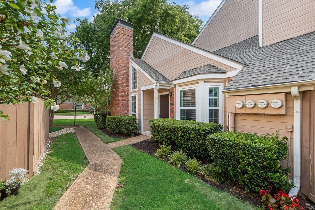 Located in the heart of Far North Dallas, this beautifully updated 2 bedroom, 2.5 bath condo offers a lifestyle of low maintenance living in an established community surrounded by mature trees, with a community pool and easy access to shopping, dining, and major commuter routes.
One of the biggest advantages of this unit is its location within the community. This home is easy to access within the community while still offering a quiet, private setting. The shaded patio provides a peaceful and private place to enjoy your morning coffee or unwind at the end of the day and includes an additional exterior storage closet.

Engineered wood flooring flows through the living and dining areas, where plantation shutters and a beautiful fireplace add warmth and character. The kitchen and bathrooms have been thoughtfully updated with quartz countertops, creating a clean, timeless look that complements the home's inviting feel. 

Both bedrooms are generously sized and feature private ensuite bathrooms along with large closets, offering exceptional storage and flexibility for guests. Primary bedroom downstairs, while upstairs, you will find the secondary oversized bedroom plus a loft perfect for home office, workout space or second living area.

Whether you're purchasing your first home, looking to simplify without sacrificing quality, or searching for a lock-and-leave lifestyle in a convenient North Dallas location, this condo offers outstanding value in a community you'll be proud to call home. One covered parking is included with this unit. Community pool for those hot summer days and public parks and tennis courts nearby.