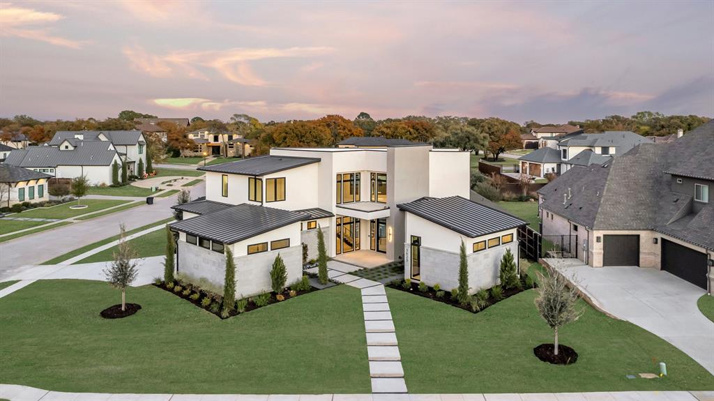 Discover this stunning contemporary home by Brian Michael Distinctive Homes, an award-winning builder featured in the 2024 Dream Home Tour. Located in Oakleigh, a prestigious gated luxury community in Colleyville, this home is perfectly positioned on a coveted half-acre corner lot at the end of a cul-de-sac, directly across from the serene community pond. The thoughtfully designed open floorplan bathes the interior in natural light, with expansive floor-to-ceiling windows and sliding doors that seamlessly blend indoor and outdoor living spaces. Overlooking the sparkling swimming pool and outdoor entertaining areas, this home offers modern elegance at its finest. Notable features include a floating staircase with sleek steel cable design, a spacious island with breakfast bar, soft-close cabinetry, a Dacor three-temperature wine refrigerator, and a well-appointed Butler's pantry with a built-in microwave and oven. This property offers versatile Office Spaces with a large primary office plus a secondary office to meet work-from-home needs. The entertainment options are endless with two Gamerooms, each with wet bars—one on the main floor and one upstairs—plus a balcony with views of the pool and spa, an extensive covered patio and outdoor living area, perfect for year-round enjoyment!
This energy-efficient home features foam encapsulation, ensuring comfort and sustainability. Nestled in Oakleigh, residents enjoy access to a private park, treed common areas, walking trails, and a pond with a fountain. Situated in the highly acclaimed GCISD, this property offers unparalleled convenience with easy access to Dallas, Fort Worth, Southlake, Westlake, and DFW, Love Field, and Alliance airports. Highways 121, 114, and 360 are just minutes away, as are a variety of shopping and dining options. This exceptional property is a must-see—schedule your private tour today!