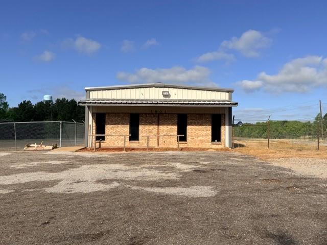 Position your business for success with this commercial opportunity in Palestine! Ideally located on the high-visibility corner of Loop 256 and N Queen Street, this 2.795-acre property offers exceptional exposure and accessibility for a wide range of commercial uses. The property features an approximately 3,000 square foot building, providing a solid foundation for your business operations, office space, or future development. Fully fenced and offering ample space, the layout is ideal for equipment storage, expansion, or customization to fit your specific needs. With strong traffic counts, excellent corner frontage, and flexible potential, this property is a rare find for investors, developers, or business owners looking to grow. Whether you're envisioning a service-based business, or a mixed-use concept, the possibilities here are endless. Don’t miss the chance to secure a strategic location with room to expand. Bring your vision and make it a reality!