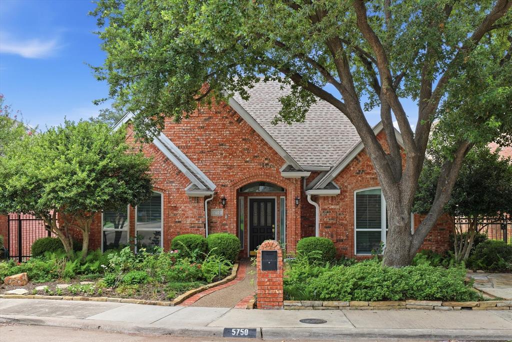Located in the private enclave of The Encore just off Preston Road and minutes from LBJ Freeway, this single-story garden home offers an excellent floor plan, mature landscaping, and a front courtyard entry that creates a welcoming first impression. Wood floors extend through most of the home, adding warmth and character to the living spaces. The spacious kitchen is located at the front of the home and features abundant cabinet storage, a center island, pantry, and a sunny breakfast nook set within a bay window overlooking the front yard. The kitchen opens to the formal dining room, creating an ideal layout for entertaining. The large family room features a fireplace, built-in cabinetry and shelving, and numerous windows that provide abundant natural light. The living area opens to a beautiful stone-decked patio complete with a remote controlled awning, creating a comfortable outdoor living and entertaining space. A separate courtyard with its own awning provides the perfect place for a fountain, enjoying container gardens and seasonal color. The private primary suite is located at the rear of the home and includes two closets and a spacious bath with dual vanities, including a sitting area, large soaking tub and a walk-in shower that has been exceptionally maintained. Two secondary bedrooms are positioned at the front of the home and share a full bathroom. This zero lot line property provides low-maintenance living while still offering attractive outdoor spaces, mature landscaping, and a small grassy area. An oversized two-car garage offers additional storage space. Conveniently located near major highways, the future Midtown development, and numerous shopping and dining destinations, this home combines comfort, functionality, and an exceptional location. Newer windows throughout the home.  AC 2018.