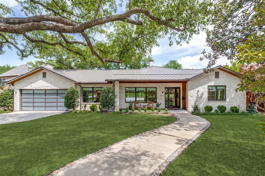 This exceptional modern ranch in the heart of Lakewood with a stone and wood exterior and a metal roof was thoughtfully designed and rebuilt in 2016. It has high ceilings and hardwood floors throughout and has expansive windows that allow for uninterrupted views of wonderfully landscaped front and back yards with private greenbelt. The open floor plan lends itself to modern living and entertainment, without compromising the privacy of the living spaces. The chef's kitchen is equipped with Wolf commercial grade cooktop, Sub-zero refrigerator, Asko appliances, modern shaker style cabinets, granite countertops, massive center island for entertaining and has a walk-in pantry in addition to a butler's pantry. There is a temperature-controlled wine storage facility for wine lovers. The master bedroom suite boasts of a vaulted ceiling, a large walk-in closet, a bath with a designer tub and a separate shower with a seating platform, double vanities and ample closet space. The covered back deck has a built-in grill, ideal for a summer barbeque with family and friends. A swimming pool with diving board and spa add to the summer fun and provide enjoyment for swimmers of all skill levels. All this in a very private wooded backyard that leads down to a ravine with a creek. The home has peer and beam construction and has a full crawl space encapsulation system installed in 2020. A 26kw Generac backup power system was installed in 2023 to ensure continuous power in emergencies. The property is located within minutes of shopping and within walking distance of Lakewood elementary school and Lakehill Preparatory School!