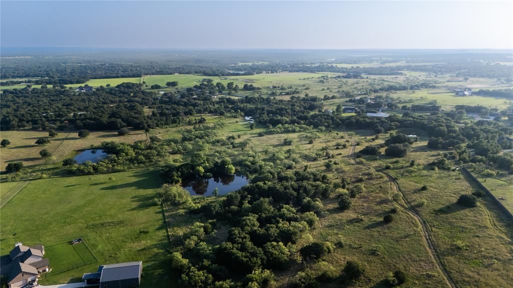 Discover the perfect blend of privacy, natural beauty, and opportunity on this 17.63-acre ag-exempt property in desirable Parker County. Fully fenced and ready for livestock, recreation, or your future dream home, this exceptional tract offers the peaceful country lifestyle buyers are seeking.

The property features a scenic pond, abundant wildlife, and an impressive collection of mature trees that provide shade, beauty, and a picturesque setting throughout the land. Whether you enjoy hunting, fishing, nature watching, or simply relaxing in a tranquil environment, this property offers endless possibilities.

With a water tap already in place, the groundwork has been laid for future improvements or a custom homesite. The ag exemption helps keep property taxes low while preserving the agricultural character of the land.

Located within the highly sought-after Brock ISD and just minutes from Weatherford, this rare Parker County property combines convenience with the privacy and freedom of country living.

Bring your horses, cattle, or building plans and make this beautiful piece of Texas your own.