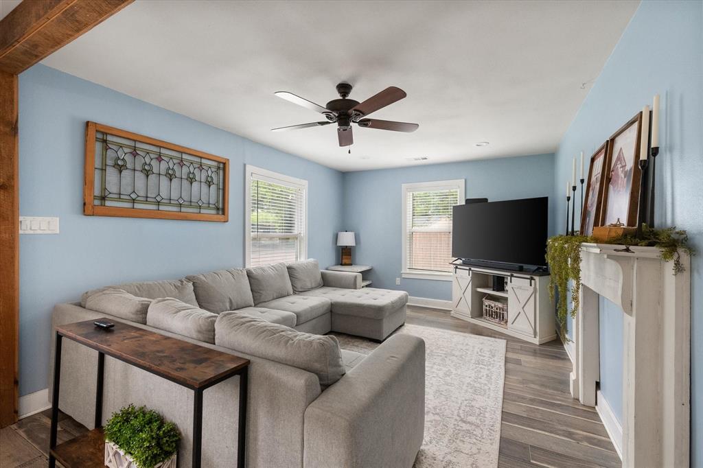 This beautifully renovated Craftsman-style home blends timeless character with modern updates throughout! Featuring 3 bedrooms and 2 bathrooms, this move-in ready property offers updated flooring, vinyl windows, custom cabinetry with granite countertops, and major system upgrades including plumbing, electrical, new roof, HVAC, and ductwork completed in 2017. The true primary suite is a private retreat with a stylish, modern ensuite bathroom. Step outside to enjoy the covered outdoor living space complete with a cozy fireplace — perfect for entertaining year-round. An oversized detached 1-car garage provides incredible storage space for tools, hobbies, or extra parking needs. A rare combination of charm, functionality, and thoughtful updates!