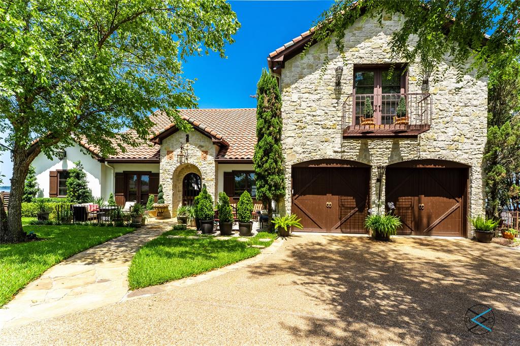 For the most discerning taste and appreciation of quality construction and design, this home must be seen in person to truly appreciate the sunset views & deep water location on Cedar Creek Lake. Three first-floor bedrooms, open to lake & courtyard views, with a wall of windows to take it all in. Flexible floor plan provides multiple areas for dining, entertaining or just relaxing. Split bedrooms allow privacy for guests and or large families. Or join collectively in the Great Room which has accommodated the grandest of gatherings. Numerous upgrades & custom features including:17th Century Italian carved door surround, Italian porcelain flooring, brick paved ceilings, to name a few. Second floor features vaulted wood ceilings and hardwood floors. Tuscany in Texas is within reach combined with world class golf and amenities of Pinnacle Golf Club. For those with more transitional taste, including a touch of Santa Barbara, this home is the perfect setting! Social membership included!