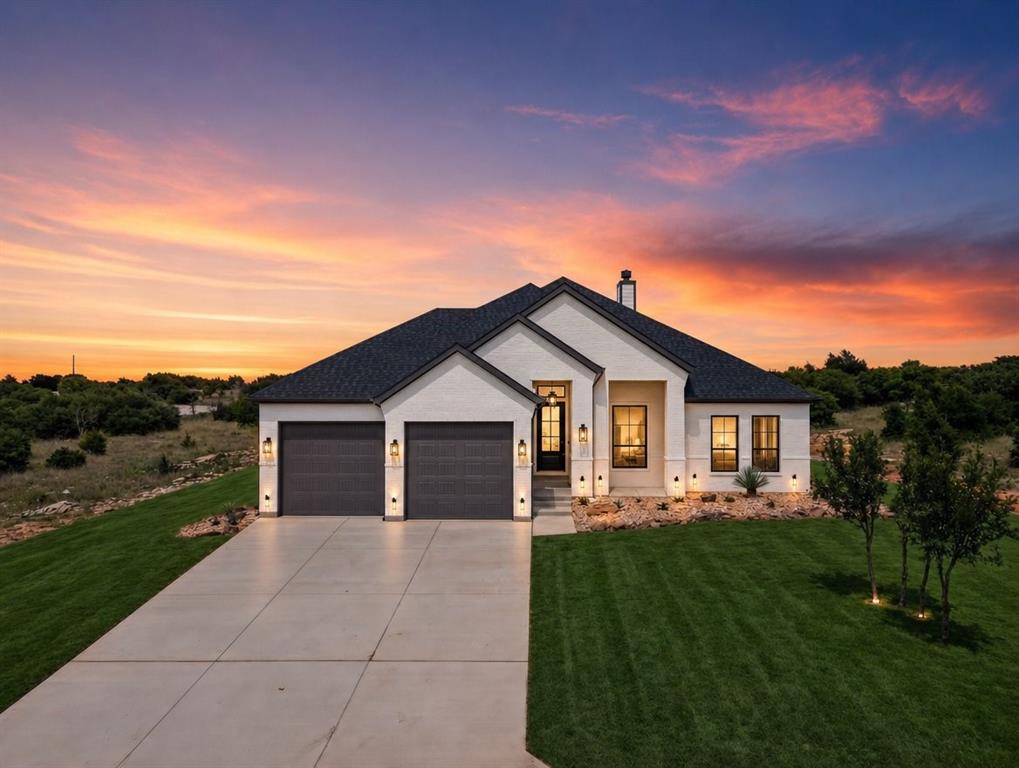 Experience refined lake living in this exceptional new build by Cheldan Homes, located within the prestigious Cliffs Resort at Possum Kingdom Lake.  Known for their outstanding reputation and commitment to quality, Cheldan delivers superior craftsmanship, thoughtful design, and elevated finishes throughout.  This is the one you've been waiting for.  Thoughtfully designed for both everyday living and effortless entertaining, this home features a spacious layout filled with intentional details and high-end touches.  Step outside to a beautifully designed outdoor area made for long evenings, gathering with friends, and soaking in the lake lifestyle.  The oversized garage offers the space you actually need for boat storage, lake toys, and more; because life at Possum Kingdom is meant to be lived fully.  Tucked into a quiet location within the community, you'll enjoy both privacy and full access to the Cliffs Resort's unmatched amenities, including 24- hour security, championship golf, multiple pools, marina access, and on-site dining. This is all set against the backdrop of one of the most beautiful lakes in Texas.  
This beauty is ready for your spring and summer at the lake! No waiting, no projects, just move in and start making memories. This isn't just a new build. It's your next chapter at the lake. Don't miss the opportunity to secure a quality-built Cheldan home in one of Possum Kingdom's most sought-after communities. Schedule your showing today!