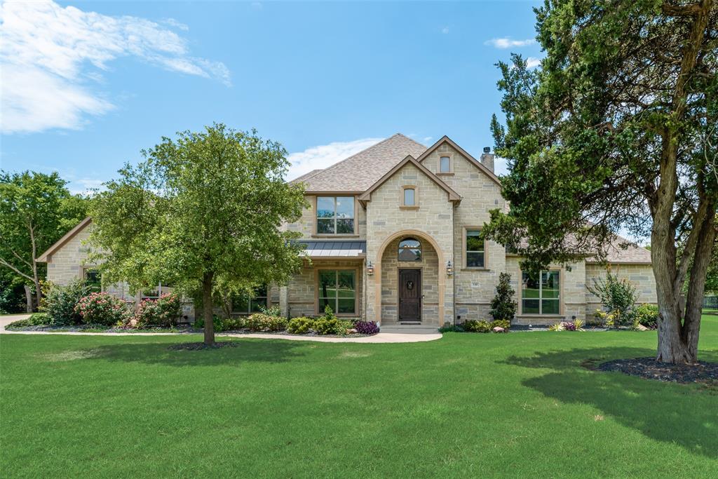 Located in the sought-after gated community of Hidden Hills, this stunning custom home sits on 1.35 beautifully landscaped acres and offers the perfect blend of luxury, comfort, and privacy. Featuring 4 spacious bedrooms, 4 full bathrooms, and over 4,000 square feet of living space, this home is designed for both everyday living and entertaining. Inside, you’ll find natural light throughout and an open-concept layout with wood flooring and built-in cabinetry. The chef’s kitchen is equipped with premium appliances, gas cooktop, double oven, oversized island, farmhouse sink, and abundant storage. The large primary suite features a spa-like bath, dual vanities, oversized shower, and custom built-ins. Additional highlights include a dedicated office, two fireplaces, a spacious 3-car garage, and an oversized utility room with sink that could double as a craft room. And you can’t forget about the media room with a built-in 110” projection screen and surround sound, perfect for watching your favorite movies or the “big game”. Upstairs, a game room or second living area provides flexible space for recreation or hosting. Step outside to your private backyard retreat complete with a heated pool, hot tub, waterfall feature, grotto, mature trees, and plenty of room for entertaining. The community lake and dock is a short walk from your backyard with no neighbors backing up to your property, helping add to that feeling of your own private oasis. This exceptional property offers peaceful country-style living with upscale finishes throughout. Don’t miss out!