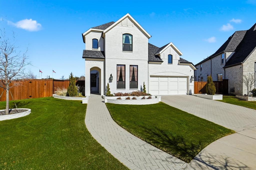 PRICE REDUCTION! The ideal blend of modern comfort with timeless elegance awaits you at this immaculate southwest-facing two story home on a super-sized lot in The Grove Frisco. Beautiful painted brick exterior gives way to a courtyard entry before reaching the front door, a truly unique entry experience. Modern double entry doors give way to a dramatic Foyer and curved stair case. The upgraded engineered wood flooring is found throughout the home, in every living space except baths, Laundry Room  and Exercise Room. No carpet! Formal Dining located off the Foyer can be used as a Study for maximum flexibility. Dramatic Kitchen with Calacatta Gold counters and Full backsplash, tall ceilings and stacked glass upper cabinets make an immediate impression. Full KitchenAid-equipped with cooktop, double ovens, microwave, integrated refrigerator and wine refrigerator! Wine storage, pot filler and many more upgrades as well. Kitchen opens to dramatic, light-filled Family Room with linear fireplace and fully-tiled surround. Upgrades continue at the rear of the home features and Extended Covered Patio, Primary Bedroom with vaulted ceiling and Sitting Area. Luxurious Primary Bath features extended vanities, freestanding tub, dramatic tiled shower with rain head and ample walk-in closet space. Guest Bedroom down with En Suite bath are located at front of home. Laundry Room leads to Exercise Rm with rubber flooring. This space can flex as a Study or Media Room. Upstairs features upgraded wood flooring in every room! Game Room with wet bar and storage room, Play Room, 2 Bedrooms and 2 Baths round out the program for the second floor. Come see for yourself what makes this home so unique and sophisticated! Other features include epoxy garage floors and whole house water filtration. The Grove Frisco is a 735ac planned community with Orchard House amenity center, two pools, a lifestyle Director, extensive green spaces and walking trails. All located within highly acclaimed Frisco ISD.