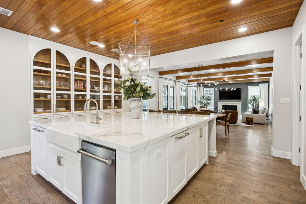 Modern Sophistication Meets Unrivaled Location

Experience the pinnacle of contemporary luxury in the heart of University Park. This architectural masterpiece offers a rare blend of avant-garde design and neighborhood intimacy, perfectly positioned for a Walkable Luxury lifestyle. Walk to UP Elementary, HPMS, Snider Plaza, SMU, and the recreation at Curtis Park, this estate represents a premier investment in Dallas’ most coveted enclave.

The expansive, light-filled floor plan features soaring ceilings and museum-quality finishes. A true epicurean kitchen serves as the home’s hearth, anchored by a 12 foot marble island and professional-grade appliances: 48 inch Sub-Zero refrigeration, 48 inch Wolf gas range, and a butler’s pantry with dual 30 inch beverage coolers. Floor-to-ceiling glass in the Great Room dissolves the lines between interior and exterior, opening to a private backyard oasis designed for high-profile entertaining.

The second level is a masterclass in privacy. The primary sanctuary is a true retreat with a spa-inspired bath featuring heated marble floors, a soaking tub, and a boutique-style dressing room. Each of the four additional guest suites includes an ensuite bath and walk-in closet. Versatility abounds with a secondary lounge on the second floor and a dedicated flex space on the third level—ideal for a gym or cinema.

Built with uncompromising integrity and full smart-home integration on a large corner lot,  this move-in-ready estate offers the rare opportunity to secure a modern legacy in a world-class location.