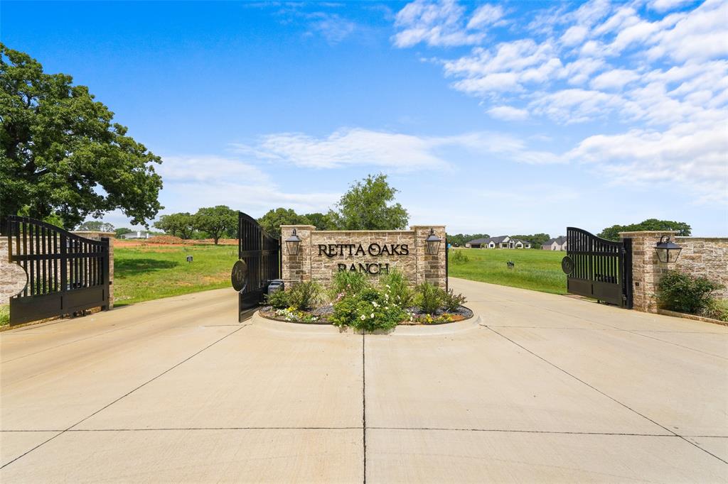 Positioned on a premier 1.65-acre corner homesite in Retta Oaks Ranch, this exceptional property offers both distinction and convenience within an exclusive gated community. The lot captures serene water views and a picturesque natural setting—an ideal canvas for a luxury custom estate.
Located outside city limits, enjoy added flexibility and privacy while remaining zoned to highly sought-after Mansfield ISD. Surrounded by estate-sized homesites, mature trees, and upscale custom residences, this community is designed for refined living and long-term value.
Bedrock Homes LLC offers a seamless, full-service design-build experience. Their team will walk the lot with you, thoughtfully design a floor plan tailored to your lifestyle, and deliver a custom home with exceptional craftsmanship and attention to detail.
With underground electric service, Bethesda water tap, a stocked pond, and elevated architectural standards, this homesite presents a rare opportunity to create a one-of-a-kind residence in a gated setting.
Secure one of the most desirable water-backed corner lots and bring your vision of luxury living to life.