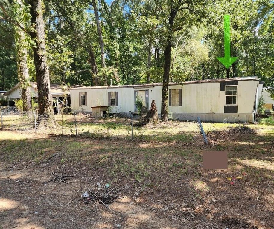 Owner financing available. Investment opportunity. 2 bed, 2 bath fixer-upper mobile home on 0.24 acre. Partially fenced corner lot with mature trees. 2-car carport & separate shed. SW of Mooringsport & Caddo Lake. This property is not in a flood zone. The mineral rights are owned by Caddo Parish. Buyer and-or buyers agent to inquire directly with the State of Louisiana Mineral Board about the possibility of the minerals transferring.