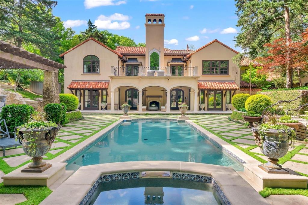 Set on an extraordinary 1.3-acre estate in prestigious Bluffview, this Mediterranean masterpiece is a rare blend of timeless architecture, privacy, and natural beauty. Designed by renowned architect Larry Boerder and masterfully built by Bob Thompson, the home showcases impeccable craftsmanship and refined architectural details throughout. With 4–5 bedrooms and multiple expansive living areas, the residence is thoughtfully designed for both everyday living and grand-scale entertaining. Inside, the kitchen features Subzero and Wolf appliances, while the primary suite is a true sanctuary, offering a large private balcony, dual baths, and separate his-and-hers closets. A 5-car garage provides ample space for collectors and storage, while the expansive grounds offer endless possibilities. The fully gated property offers exceptional privacy and includes a well-appointed guest house. Outdoor living is unparalleled, featuring a sparkling pool, covered patio, and multiple entertaining spaces that seamlessly connect with the surrounding landscape. The breathtaking topography, lush mature trees, and serene setting create a retreat-like atmosphere—so remarkable, it’s hard to believe you’re in Dallas. This is a one-of-a-kind estate where architecture, nature, and luxury converge in one of Dallas’s most coveted
neighborhoods.