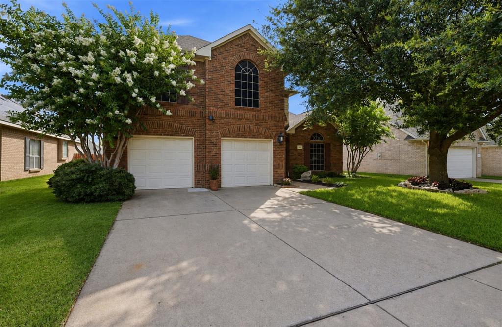 Welcome to this beautifully designed 4-bedroom, 2.5-bath home offering an ideal blend of space, comfort, and functionality in a prime Burleson location. Conveniently situated just minutes from Hwy. 174, you'll enjoy quick access for commuting along with nearby shopping, dining, and everyday conveniences.
Step inside to soaring ceilings and an inviting floor plan that immediately feels open, bright, and welcoming. Off the entry, you'll find a formal dining room, perfect for gatherings and entertainment, and an adjacent office space that could double as a formal sitting area. A conveniently located half bathroom is nearby. The spacious living room is the heart of the home, featuring a wood-burning fireplace, and oversized windows that fill the space with natural light. Designed for both everyday living and entertaining, the open layout flows seamlessly into the kitchen and breakfast area.

The beautifully appointed kitchen offers granite countertops, a large center island, breakfast bar, and a sunny breakfast nook overlooking the backyard. A separate coffee bar area with elegant glass-front cabinetry provides the perfect spot for your morning routine while adding both style and additional storage.

The split-bedroom floor plan places the private primary suite on the main level, creating a peaceful retreat. The spacious ensuite bathroom features dual vanities, a large soaking tub, separate walk-in shower, and an oversized walk-in closet.

Upstairs, you'll find three generously sized secondary bedrooms, each with excellent closet space, along with a full bathroom and a second living area. With new carpet throughout the staircase and upper level, this versatile space is ready to become a game room, media room, playroom, or an additional lounge space tailored to your lifestyle.

Step outside to enjoy the large covered patio overlooking a privacy-fenced backyard, creating the perfect setting for outdoor dining, weekend barbecues, or simply relaxing in the shade.
