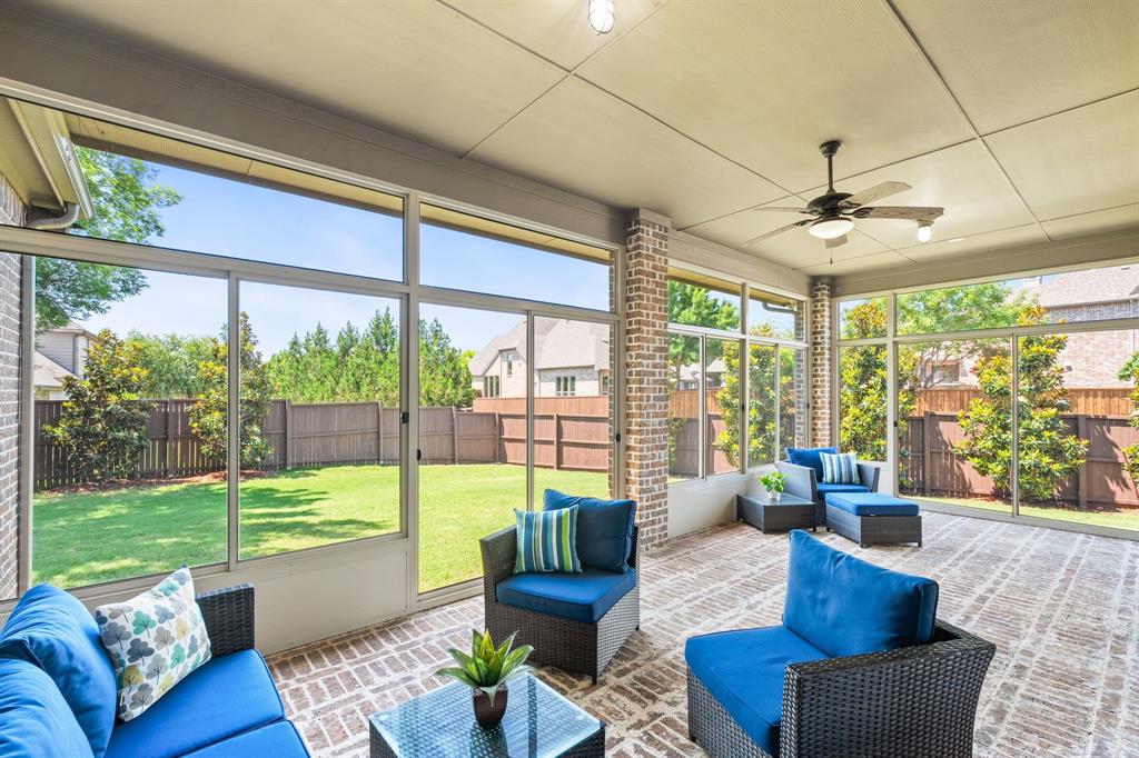 ABSOLUTE PEACE OF MIND MEETS LUXURY LIVING WITH AN UNMATCHED OUTDOOR RETREAT! Rarely do you find a custom home upgraded with this level of meticulous care, boasting a 2026 roof, 2025 HVAC systems, and a 2023 water heater. What truly sets this property apart is the spectacular, oversized screened porch, a massive selling point that completely redefines North Texas outdoor living. Complete with classic brick flooring, this sanctuary opens up fully to create a seamless indoor-outdoor experience, overlooking a massive backyard shaded by beautiful magnolia trees. Premium structural highlights continue with a 3-car tandem garage featuring sleek epoxy flooring, a built-in mudroom bench, double-pane windows, a whole-house water softener, and a professional water treatment system with microbiological filtered drinking water. Wrapped in fresh paint, this home inside McKinney's award-winning Stonebridge Ranch community delivers a turnkey luxury experience. Rich hardwood flooring, soaring ceilings, and designer lighting set an elegant tone from the moment you step inside Wynn Ridge Estates. The rare, functional layout features both the primary suite and a secondary bedroom with a full bath on the main floor, perfect for guests or multigenerational living. The open-concept kitchen serves as the heart of the home, showcasing white cabinetry, granite countertops, a gas cooktop with a griddle, a walk-in pantry, a Butler’s pantry, and a generous stained island. The adjacent living area is anchored by a striking floor-to-ceiling stone fireplace and a wall of windows. The primary suite is a true retreat with bay windows, dual walk-in closets, a garden tub, and an oversized shower. Upstairs features a spacious game room, a media room, a half bath, and two bedrooms, each with an en suite bath and walk-in closet, offering room for everyone. Enjoy resort-style pool, tennis, pickleball, and golf cart access to country clubs, Adriatica Village, and Westgrove dining!