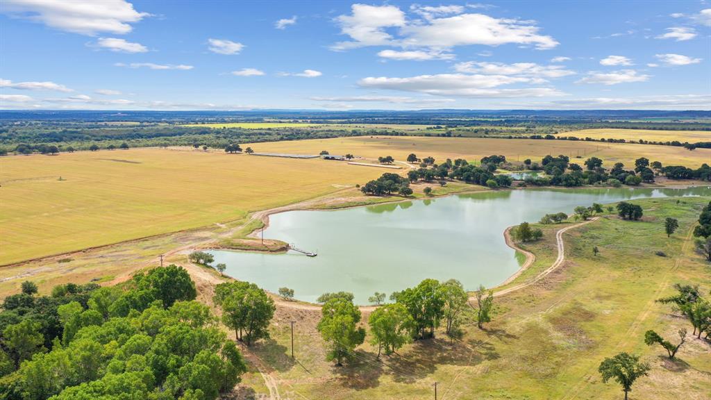 The Perfect Ranch!! I always get asked for a cattle or hay place with water... well here you go!! Comprised of just over 330 acres, with road frontage on Hwy 36, Cr 274 and Cr 131. This one is about as good as they come folks! Two irrigation pivots, 26 water wells connected together producing approximately 176 gpm. They pump into the lake and both pivots feed out of the lake! This is one of the most productive places I have ever seen, just this year the owners have baled over 1500 bales off of it. The 20 acre lake is stocked with bass, catfish and grass carp, and the fishing is fantastic. The place has excellent perimeter and cross fencing. There is a super nice hay or equipment barn that is 60x120. The ranch is divided into 5 pastures. There are several fantastic building sites and the metal building has a water storage tank and filtration system. If you are looking for a 100% complete, turn key ready to go to work ranch, look no further! Come and see it for yourself!!