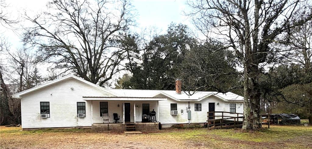 Escape to the peaceful charm of country living at 120 Bessie Crow Road in Coushatta, Louisiana. Nestled on approximately 3 cleared acres, this spacious 4-bedroom, 2-bath home with approx 2312 sfha offers room to spread out both inside and out while still being just minutes from downtown Coushatta.

A standout feature of this property is the front porch overlooking beautiful acreage, perfect for relaxing with your morning coffee, enjoying quiet evenings, or gathering with family and friends while taking in the serene rural surroundings. With two separate entrances, the home provides convenient access and added flexibility for everyday living.

Inside, you will find a generous floor plan designed for comfort and functionality. The home offers four large bedrooms, including two primary bedrooms, making it an excellent option for multi-generational living, extended guests, or a private office space. Ceiling fans throughout the home help maintain comfort year-round, while the walk-in closet in the second primary bedroom offers great storage.

The large backyard and open acreage provide endless possibilities. Whether you are dreaming of a garden, workshop, outdoor entertaining space, or simply enjoying the privacy of your own land, this property offers the space to make it happen. The newer metal roof adds peace of mind and durability for years to come.

Located in a quiet rural setting just a short drive from local schools, shopping, dining, and community amenities in Coushatta, this property offers the perfect balance of country tranquility and everyday convenience.

If you're looking for space, privacy, and small-town charm, this property is ready to welcome you home. Schedule your private showing today and discover the possibilities waiting for you at 120 Bessie Crow Road.