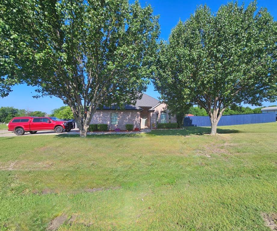 Welcome to this beautifully updated 4 bed, 3 bath two story home set on a spacious one acre lot in a cul-de-sac and best of all, no HOA! From the moment you arrive, you’ll appreciate the extended driveway with RV parking, mature surroundings, and added privacy from the newly installed gated privacy fence (2023). Step inside to discover a thoughtfully designed layout, featuring custom touches throughout including upgraded flooring, arched doorways, and higher end finishes.  The inviting living room is the heart of the home, showcasing a stacked stone fireplace with a rich wood mantle. The kitchen is equally impressive with off white cabinetry, built ins, granite countertops, and pantry flowing seamlessly into the dining area that is ideal for entertaining or daily meals. The spacious primary suite is filled with natural light and offers a fully remodeled ensuite bath with dual vanities and separate custom shower. Both the downstairs and upstairs bathrooms have been tastefully remodeled (2025). The stairs and second level features brand new carpet (Jan 2024), adding comfort and a fresh feel.  Two additional bedrooms are conveniently located on the main level, while the upstairs offers incredible flexibility—perfect as a large game room living area along with a bedroom and full bath.  Step outside to enjoy the extended covered patio overlooking a peaceful tree line and fire pit area that is perfect for relaxing or hosting gatherings. In addition, a 12 x 24 workshop provides the perfect space for tinkering, hobbies, or storing toys and equipment.  This home offers space, style, and flexibility in a fantastic neighborhood so don’t miss the opportunity to make it yours!  Updates: AC units (Upstairs 2021 & Downstairs 2025), Roof and Gutters (2020), Privacy Fence (2023), Remodeled baths (2025), Carpet (2024) .
