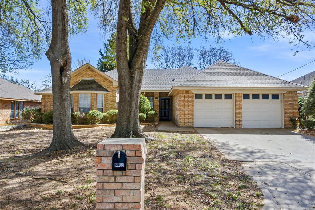 Nestled in desirable Westgrove Estates community of South Arlington, 6009 Kenilworth Dr offers comfort, Charm and thoughtful updates throughout. Mature shade trees provide beautiful curb appeal and a welcoming first impression. Step inside to a spacious living room featuring soaring high ceilings and a stunning brick veneer fireplace, creating the perfect space for relaxing or entertaining. The large offers ample counter space along with a dedicated coffee bar area. Enjoy the durability and modern appeal of no carpet throughout the home, making maintenance a breeze. Major updates include a new roof replaced in 2025, offering peace of mind for years to come.