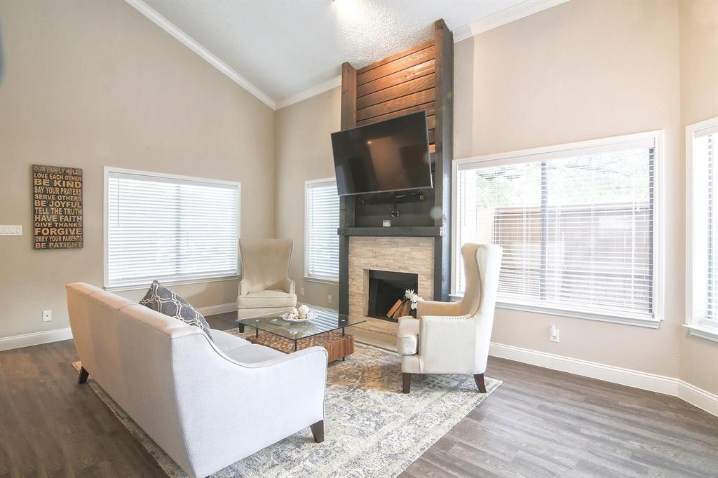 HVAC REPLACED THIS YEAR! Beautifully renovated condo that combines modern style, comfort, and convenience in an unbeatable location. Step inside to a bright and inviting living area featuring soaring ceilings, abundant natural light, rich finishes, and a stunning floor-to-ceiling fireplace with custom wood accents that serves as the centerpiece of the home. The updated kitchen showcases white shaker cabinetry, sleek countertops, stainless steel appliances, and a timeless marble-look backsplash, creating a clean and sophisticated space for cooking and entertaining. The fully remodeled bathroom offers a spa-like retreat with an oversized walk-in shower, dual-sink vanity, designer tile work, and contemporary fixtures. A versatile converted room provides the flexibility of a home office, study, guest room, or additional living space to fit your needs. Outside, enjoy a private patio perfect for relaxing, entertaining, or enjoying your morning coffee. Conveniently located just one mile from both US-75 and the President George Bush Turnpike, this home provides easy access to shopping, dining, entertainment, and major employment centers. With its exceptional condition, thoughtful updates, flexible floor plan, private outdoor space, and prime Richardson location, this is a rare opportunity you won't want to miss.