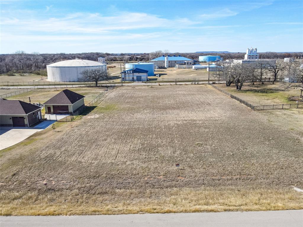 Welcome to 209 Maverick Court, a beautiful cleared and build-ready homesite located in the gated community of Rolling Creek Ranch in Granbury. This property offers an excellent opportunity to design and build your custom home without the added expense and effort of clearing the lot, as much of that work has already been completed. The lot is conveniently positioned near the front of the subdivision on a quiet street that is not a through road, providing easy access in and out of the community while still maintaining a peaceful setting with limited traffic. Rolling Creek Ranch is known for its rolling terrain, mature oak trees and inviting country atmosphere. Neighborhood amenities include a secured gated entrance, two stocked fishing ponds, a community pavilion and park, sports fields, basketball and pickleball courts. Owners may select their own builder, and there is no required time frame to begin construction. A minimum home size of 1,800 square feet helps preserve the quality and character of the community. The property is located just a short drive from Granbury’s historic square with dining, boutique shopping, entertainment and year-round events. Granbury has been recognized multiple times as one of America’s Best Historic Small Towns. Fort Worth is also within convenient commuting distance at approximately forty minutes. If you are looking for a build site that offers an attractive setting, a well-maintained community and a great Granbury location, this lot deserves your consideration.