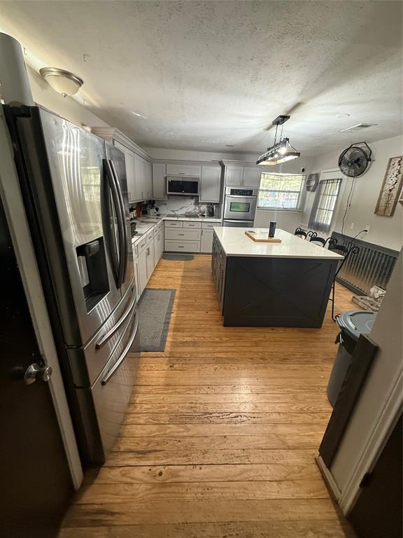 Charming farmhouse style meets functional acreage on 1.6+ acres in Kemp. This unique property features a main house with dual primary suites, vaulted ceilings, and a large island kitchen with granite countertops. Included is a 480 sq ft 'Tiny Home' guest house with a full kitchen and bath, plus a 700 sq ft 'man cave' building plumbed for a bath. Outside, enjoy an above-ground pool with a large deck, chicken coop, and electric fencing for livestock.