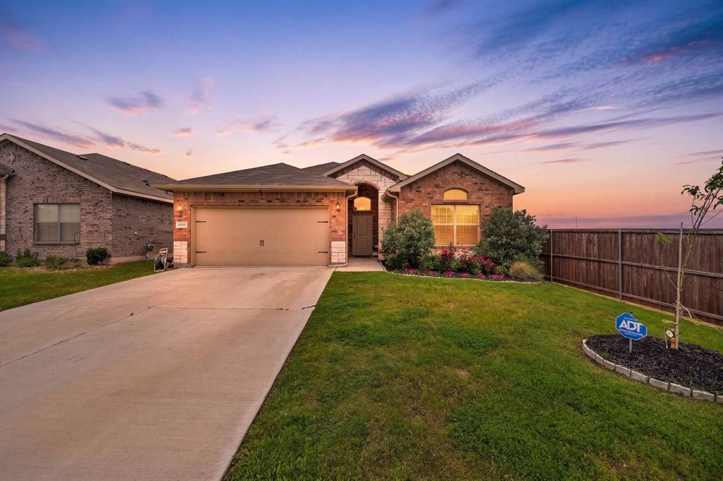 Nestled at the end of a quiet cul-de-sac in West Fort Worth’s prestigious Highlands at Chapel Creek, this residence combines everyday convenience with the serenity of an elegant retreat. Easy access to I-30 and 820 keeps the city within effortless reach, while your home remains a peaceful sanctuary. Step inside to an open, light-filled layout that invites both relaxed living and refined entertaining. Classic wainscoting flows throughout the home, adding architectural character and a grand, upscale ambiance. At the heart of the home, the chef’s kitchen offers a generous island, granite countertops, stainless steel appliances, 5-burner gas range, and a spacious walk-in pantry—an ideal space for gatherings large and small. The thoughtful split-bedroom design ensures privacy, with a gracious primary suite tucked away as your personal haven. Here, a dual-sink vanity, oversized 5-foot shower, and expansive walk-in closet create a spa-like atmosphere for unwinding at day’s end. The setting is nothing short of extraordinary. This rare lot is uniquely private, bordered on two sides by lush green space. The backyard borders on two sides to TWO tranquil community ponds with decorative fountains, filling your home with the soothing soundtrack of falling water—resort-style calm, right outside your door. Relax on the covered back patio within your fully fenced yard, perfectly suited for quiet mornings or sunset conversations. Modern comforts include Smart Home technology, a tankless water heater, and a full sprinkler system. Residents enjoy a community pool and playground, and are just minutes from premier shopping, dining, and the cultural energy of Downtown Fort Worth and Sundance Square. Here, comfort, beauty, and convenience come together—this is the home you’ve been waiting for.