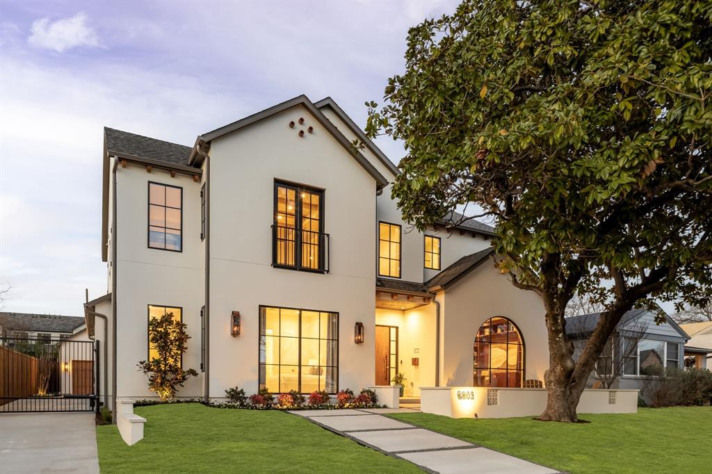 Set on one of Lakewood’s most desirable streets, this Mediterranean-inspired new construction by Gramercy Custom Homes blends timeless architecture with sophisticated living. Just off the front porch, a charming courtyard creates a warm and inviting first impression, setting the tone for the thoughtful design found throughout the home. Inside, every detail has been thoughtfully curated, from hand-selected finishes and artisan tile to designer lighting and wallcoverings that elevate each space. The chef’s kitchen is both stunning and functional, featuring top-of-the-line Sub-Zero and Wolf appliances, a prep pantry with workstation sink and second dishwasher, and a hidden walk-in storage pantry. Nearby, a striking custom white oak bar with hidden beverage drawers is perfectly positioned for effortless entertaining while an impressive 16-foot sliding door extends the main living area to a private, resort-style backyard complete with a heated covered patio, sparkling pool and spa, and turf yard. As the sun sets, enjoy movie nights under the stars with the 142-inch outdoor power projector screen — a true extension of the home’s entertaining capabilities. Inside, the thoughtfully designed first floor offers a generous guest suite, a study with custom built-ins, a separate flex room ideal for a home gym or second office, and a spacious mudroom with pool bath and second laundry center. Upstairs, custom double white oak doors open to the serene owner’s retreat, highlighted by a show stopping arched glass shower and a fully custom closet. The second level also features an additional living area with wet bar, two generous secondary ensuite bedrooms, and the main laundry room. Additional highlights include a full smart home system with Lutron lighting, Sonos sound, and integrated security cameras. Located just a short stroll from Lakewood Elementary, Lakewood Park, and White Rock Lake, don’t miss this opportunity to own something truly special in the heart of Lakewood.