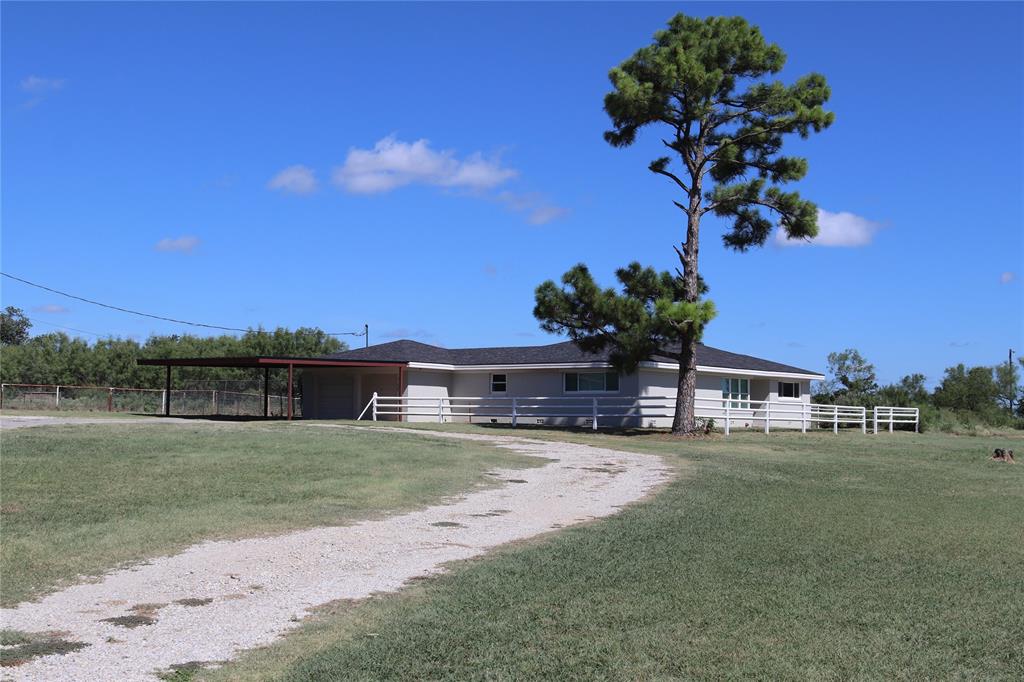 2.3 ACRES Spacious hilltop home on the outskirts of Jacksboro! Well kept brick 3 bedroom, 3 bath, 2 car garage with 2 car carport. Open floor plan with bay windows. Large master bath with walk-in closet and garden jacuzzi tub. Comfortable sized bedrooms. New roof and replacement windows. Plantation blinds master bedroom and bath. Fenced back yard and perimeter fenced 2.3 Acres with a loafing shed. Room for a garden and chickens. Perfect for those FFA & 4-H livestock show projects or to keep those day working horses. Circle driveway. Just minutes to schools.