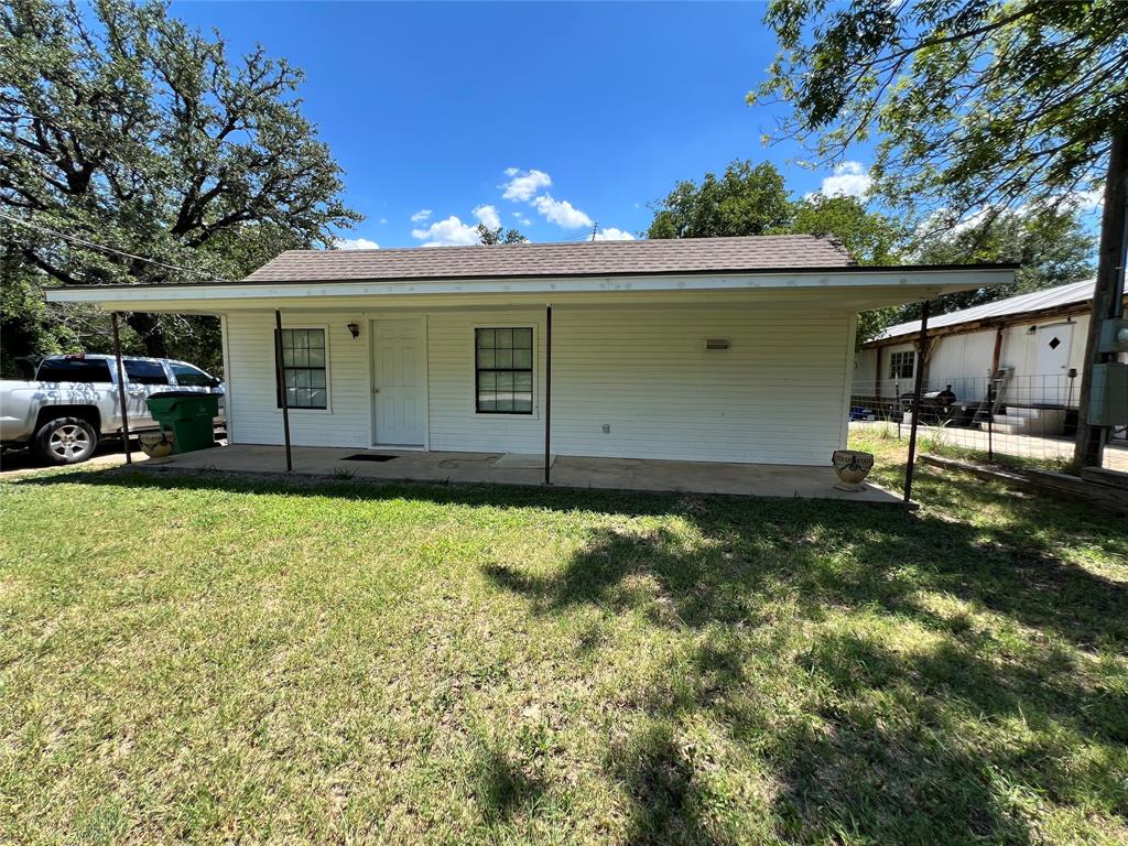 Discover comfort, space, and country-edge living at 104 E. Little St. This well-kept 2-bedroom, 1-bath home offers a welcoming layout with multiple living areas and thoughtful features throughout. The home was completely renovated in 1985 to include double pane windows, added insulation and additional rooms were added at that time.

Step inside to find a bright bonus living area along with a cozy family room, giving you flexibility for relaxing, entertaining, or creating a dedicated workspace. The kitchen features classic wood cabinetry, all-electric appliances, and a separate dining area perfect for everyday meals or gatherings.

Both bedrooms are comfortably sized, and the home’s clean, well-maintained condition makes it truly move-in ready. Enjoy the convenience of city utilities while still being just outside of town, offering a peaceful setting with easy access to Hamilton’s amenities.

Front and back porches provide great spots to unwind, sip your morning coffee, or enjoy evening breezes. The home sits on a solid slab foundation and features a durable composition roof for long-term peace of mind.

This property is ideal for anyone seeking a quiet location, a practical layout, and a home that’s been genuinely cared for.