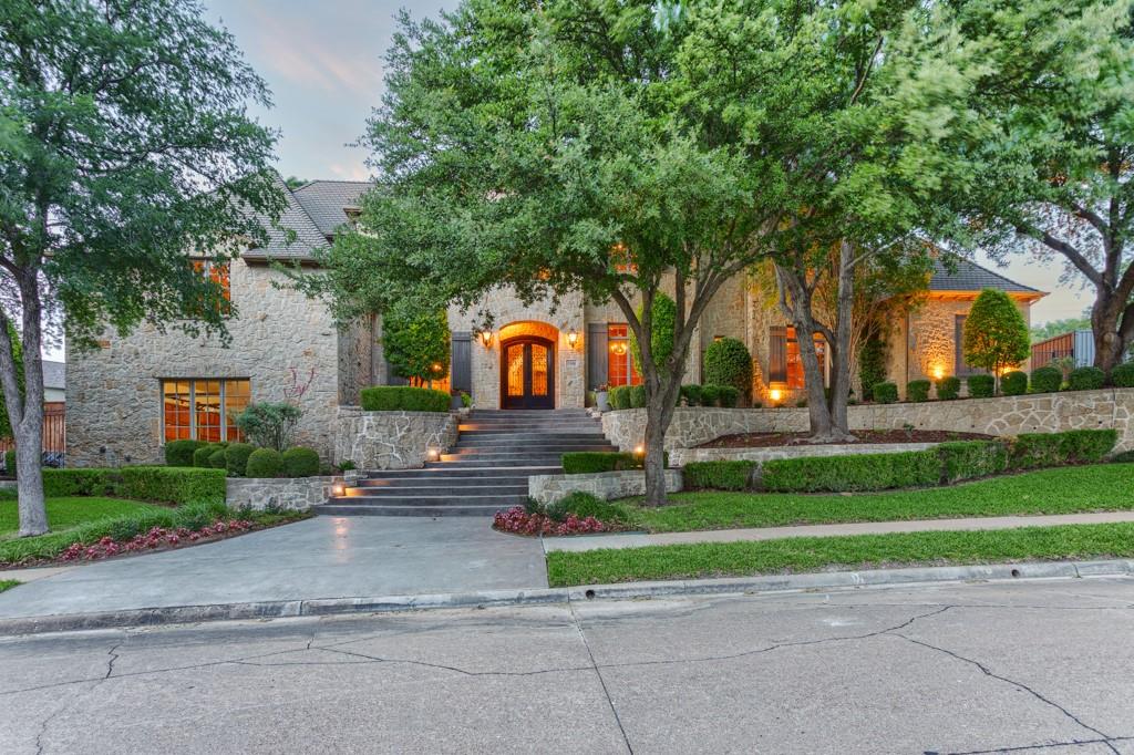 Experience resort-style living every day on this expansive 0.5+ acre estate, thoughtfully designed for comfort, elegance, and entertainment.

This exquisite home features a spacious and versatile layout, including a fully renovated downstairs guest suite (2022), formal living and dining rooms, a custom study, dedicated exercise room, upstairs reading nook, game room, media or playroom with a newly added home theater system, dual wet bars, a second utility room, and abundant storage throughout. Each bedroom includes a private en suite bath, ensuring comfort and privacy for all.

The gourmet kitchen, fully renovated in 2022, is a chef’s dream with new granite countertops, custom cabinetry, a new gas stove, two dishwashers, and a built-in custom refrigerator. The kitchen opens to a light-filled family room with floor-to-ceiling windows, a stunning stone fireplace, and panoramic views of the backyard oasis.

The private primary suite offers a serene retreat with a built-in coffee bar, spa-like bath, custom walk-in closet, and a cedar-lined storage area.

Step outside to your backyard paradise, where tiered patios, a built-in grill, and a cozy two-way fireplace create the perfect setting for outdoor living. The centerpiece is a breathtaking four-tiered pool and spa with cascading rock waterfalls, surrounded by mature oak trees and lush landscaping. The pool includes new pumps and a remote control system for added convenience.

Additional upgrades include five new AC units (2022), a new irrigation system, and other modern improvements that ensure comfort and peace of mind.

This is luxury living at its finest—an entertainer’s dream and tranquil sanctuary in one.