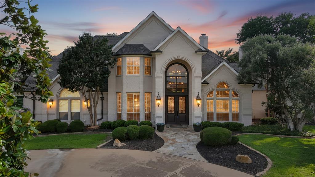 This is the home you've been waiting for! The home has fabulous curb appeal beginning with the motor court driveway that offers ample parking to the side load 3-car garage and designer lights, gutters and front entry, the home is stunning! Inside you'll find thoughtfully designed spaces including a dedicated office, first floor game room with a wet bar, spacious living room with a floor to ceiling fireplace and windows overlooking the recently renovated pool. Outdoors, you'll love the swim-up bar, pool waterfall and entertaining space in addition to the cross-fenced acreage that's ready for your horses! This neighborhood is tucked away out of the city limits yet still in Mansfield ISD which makes it ideal!