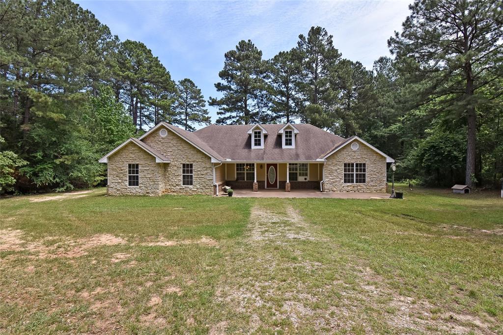 Come home to paradise in this stunning 3 bed, 2 bath home on a 57-acre property. The spacious living room with a stone fireplace creates a warm and inviting atmosphere, while the kitchen boasts an abundance of storage and a formal dining room. The master suite is a private retreat with a double vanity and multiple walk-in closets. The additional bedrooms are perfect for guests or family. The large bonus space offers endless possibilities for a home office, game room, or gym. Enjoy the covered patio with views of the large pond, and take advantage of the 16x20 barn, 20x30 RV cover, and carport. Schedule a tour today and discover your own piece of paradise.