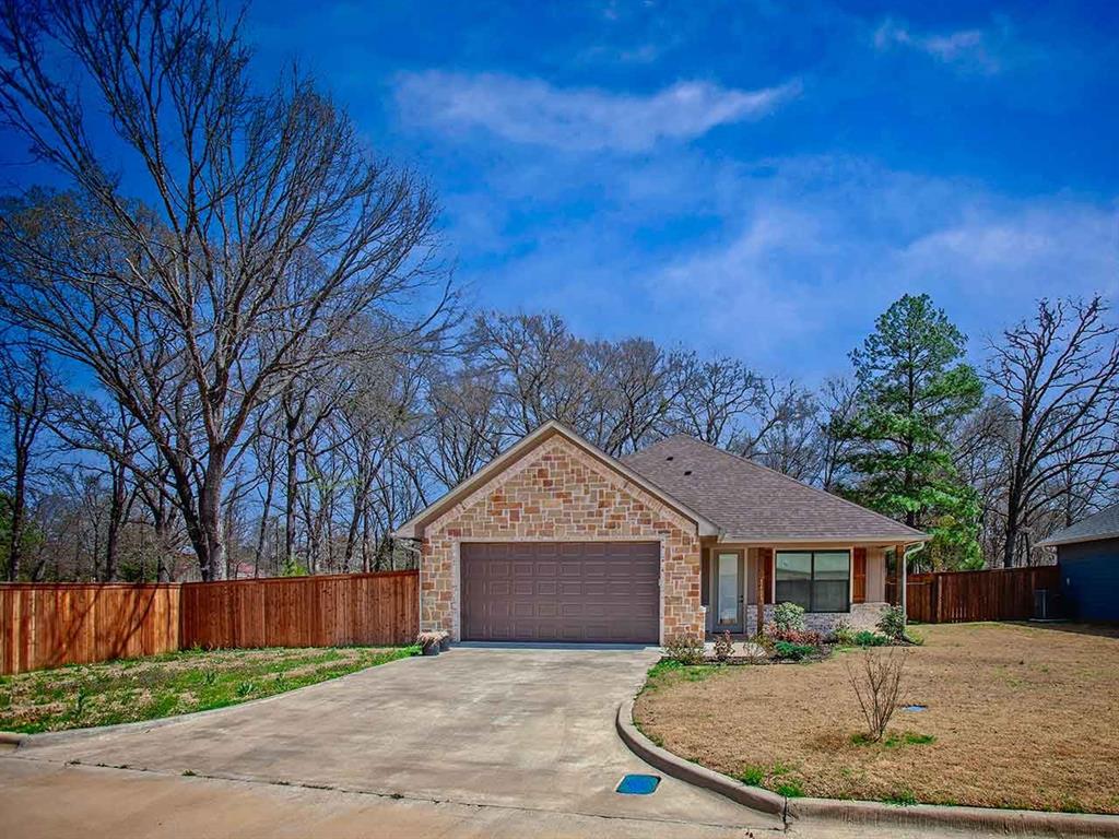 Small Town East Texas Lifestyle is Waiting for You! Welcome home to this 2022 built 3-2-2 home with a charming front porch. The popular open living, dining & kitchen areas have great natural light. Handsome granite counters, stained cabinets and stainless appliances make meal prep & entertaining enjoyable. The laundry closet is in the hallway off the kitchen. Luxury vinyl plank floors are so easy to clean and maintain, with carpets in the 3 bedrooms which is so easy on bare feet! The primary bedroom has a walk-in closet with adjoining private bath. Shower-tub combination with safety glass door, the dressing area has dual sinks, stained cabinets and lots of storage. two guest bedrooms share access to hall bath with shower-tub and single sink with granite counters. Covered rear patio faces east so enjoyable for morning coffee and cool evenings. Pets and Littles have a private, fenced yard to enjoy! Small town of Emory, Texas has a population of 1,390 (2026 est.) and is located between Lake Fork (famous trophy bass) and Lake Tawakoni. Young and not so young alike will love this home! Make it yours, today!