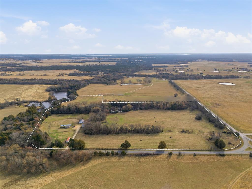 Discover your slice of Texas paradise on this exceptional 21-acre (approx.) estate in the heart of Whitesboro, Grayson County - a rare blend of serene natural beauty, proven tax advantages, and prime build-ready potential. This ag-exempt gem (active agricultural exemption on 20 acres - approx.) delivers substantial annual property tax savings while providing an idyllic canvas for your dream private luxury homestead, legacy ranch, or recreational retreat. Wake to peaceful mornings along a picturesque, meandering creek that winds through the property, creating a park-like setting rich with wildlife and framed by mature trees and rolling terrain. Elevated building sites offer sweeping views, while the gentle topography ensures multiple ideal spots for your custom home or estate. An existing mobile home with RV hook-up, plus an additional outbuilding, adds immediate utility and convenience. Water lines run near the property line, making development straightforward. Best of all, you're an approximate 8-minute drive from the shores of Lake Texoma - perfect for boating, fishing, and weekend escapes - yet tucked away in peaceful countryside with easy access to Highway 377 and nearby growth corridors. The ultimate North Texas retreat awaits!
Please do not enter the property without approval. Broker or Listing Agent to be present at showings.
Buyer and Buyer's Representative to do all due diligence. Contact the city and county for property information, including AG exemption verification. A new survey will be required. Lot lines are approximate. Information deemed reliable but not guaranteed.
