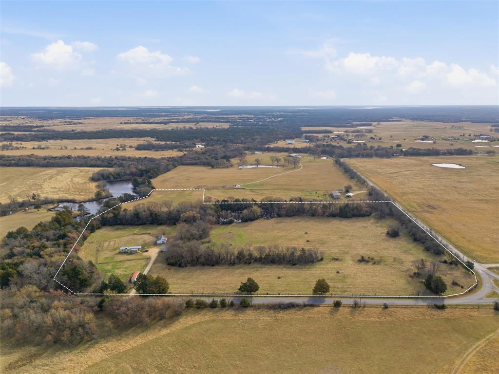 Discover your slice of Texas paradise on this exceptional 21-acre estate in the heart of Whitesboro, Grayson County - a rare blend of serene natural beauty, proven tax advantages, and prime build-ready potential. This ag-exempt gem (active agricultural exemption on 20 acres) delivers substantial annual property tax savings while providing an idyllic canvas for your dream private luxury homestead, legacy ranch, or recreational retreat. Wake to peaceful mornings along a picturesque, meandering creek that winds through the property, creating a park-like setting rich with wildlife and framed by mature trees and rolling terrain. Elevated building sites offer sweeping views, including glimpses of the neighbor's large pond, while the gentle topography ensures multiple ideal spots for your custom home or estate. An existing mobile home with RV hook-up, plus an additional outbuilding, adds immediate utility and convenience. Water lines run near the property line, making development straightforward. Best of all, you're just a quick 8-minute drive from the shores of Lake Texoma - perfect for boating, fishing, and weekend escapes - yet tucked away in peaceful countryside with easy access to Highway 377 and nearby growth corridors. The ultimate North Texas retreat awaits!
Buyer and Buyer's Representative to do all due diligence. Contact the city and county for property information, including AG exemption. A new survey will be required. Information deemed reliable but not guaranteed.