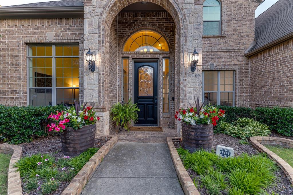 Welcome to this beautifully updated home featuring soaring ceilings, elegant architectural details, and exceptional indoor-outdoor living. A dramatic curved staircase and grand two-story entry create an impressive first impression, hardwood flooring throughout the main living areas.
Fully remodeled chef's kitchen, showcasing an oversized island with Quartzite countertops, solid beech cabinetry, stainless steel appliances, 6 burner gas cooktop, designer lighting, and abundant storage. The luxurious primary suite offers a spa-inspired bath with freestanding soaking tub, oversized marble shower, and upscale finishes throughout. Spacious primary closet with staircase access to an expansive bonus storage area. Downstairs bedroom with adjacent full bath provides the perfect retreat for guests or an older child seeking additional privacy. The private remodeled guest bath features designer finishes,  frameless glass shower, quartz countertop, and modern matte-black fixtures. Upstairs, two sizable secondary bedrooms are connected by a convenient Jack-and-Jill bath. Expansive media and game rooms provide endless possibilities—from movie nights and game-day gatherings such playing on a golf simulator.  Private resort-style backyard featuring a sparkling pool with tanning ledge, water features, in-pool loungers, and generous patio space perfect for entertaining, relaxing, and enjoying warm Texas evenings.  Heritage is North Fort Worth's most sought-after, award-winning master-planned community with plenty of community events to enjoy. Just minutes from Alliance Town Center & I35, this beautifully updated residence combines luxury, comfort, and convenience.