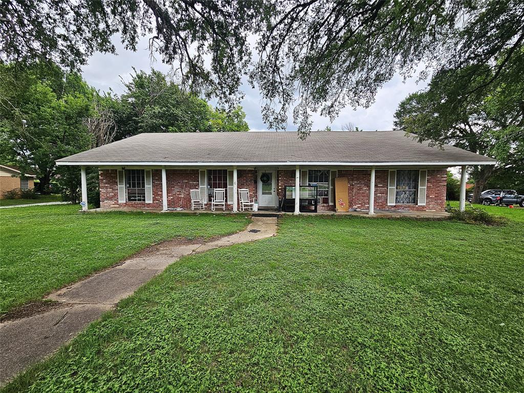 Space and huge potential!  This is a 5 bedroom, 2 bathroom brick home located in an established neighborhood in Groesbeck, TX.  Home is on an oversized corner lot, has mature trees, 2 car garage and some fencing.  Interior features include 2,242 square feet, central heat and air units replaced last year, spacious living room and nice sized kitchen!