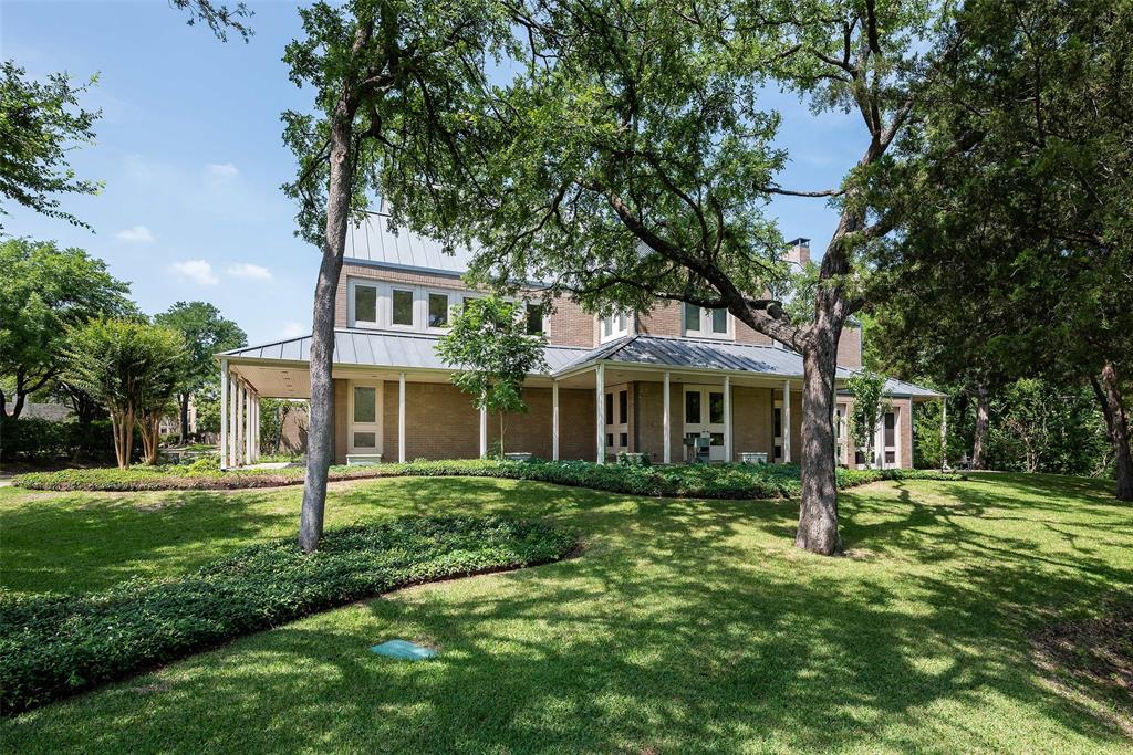 Note* (Main house 5309 SF. Studio is 3946 SF. Bedroom and bathroom over garage could be 4th bedroom. Cabana with full bath could be 5th bedroom.) Nestled on 1.3 acres by a private lake in Preston Hollow, this modern hill country home was designed by architect Frank Butler. Main house has 3 bedrooms, 3.5 baths, screened porch overlooking the grounds and water, library-music room, large primary suite with FP and adjoining study, quarters over garage, cabana & a beautiful pool. Recently having undergone a nearly complete renovation, the home shows like new. In addition to the main residence, the property has an incredible purpose built exercise studio of nearly 4000 SF. This versatile space offers possibilities for entertainment or fitness and can easily be transformed into a recreation room, guest house, event space, or full gym. This exceptional home combines elegance, comfort & a connection to nature in a truly unique setting.