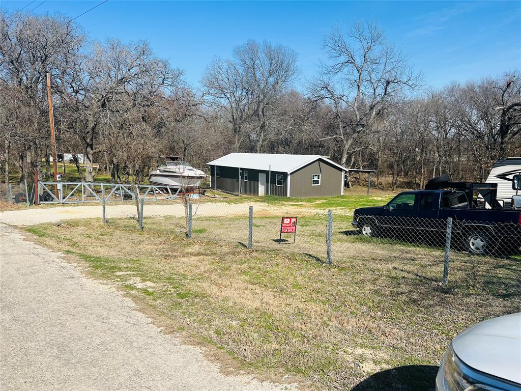 Absolutely RARE Approximately 1.48 Acres with a Metal Shop on a slab and Two Metal carports just minutes from I-35W with access to the frontage road and also access off Quail Haven. Could be commercial verified with the City of Alvarado. Seller is motivated will help with money for closing costs.