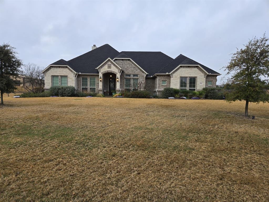 Beautiful, neutral color pallet, custom four bedroom, three bath, split open concept home on 1.28 acre lot located in popular, friendly, Bryson Springs Estates neighborhood; zoned for sought after Midlothian schools! This quality, well built home is a beauty with plenty of upgrades! -Exterior is complete brick and stone with covered front porch surrounded by professional landscaping. -Large covered back porch with two lit ceiling fans , wiring for outdoor television, and pool bath access overlooks large back yard. -Three car, side entry garage with storage room, entry to mudroom with built in wood bead board and storage cubbies -Work from home in the private, french doored home office. -Large fourth bedroom with private access, large walk in closet, and full bath can be utilized as flex room or in-law suite. -Great room has tall wood beamed ceiling and features a lovely focal point of a floor to ceiling stacked stone veneered fireplace flanked with quality built in shelves and lower cabinets. -Gourmet custom kitchen features granite countertops, upgraded appliances including double oven, stainless steel interior dishwasher, and five burner cooktop. Abundant, beautifully designed, under-lit wood cabinets with large, automated lit, walk in pantry provides abundant storage for a well stocked kitchen. Kitchen island with deep modern stainless steel sink. Upgraded beautiful double pendant island lighting -Enjoy meals and beautiful sunsets in large breakfast room with upgraded, dimmable chandelier for dining ambience. -Large private Owner’s Suite with tray ceiling, and large windows with built in window seat shelf. French door entries to private luxury bath and large walk in closet located within. -Owner’s Suite bath is the luxurious jewel box of the home, featuring a large, beautifully tiled, walk through shower with bench, niche, and two shower heads. -Relax soaking in the separate, lovely, spa like tub under the dimmable crystal chandelier.