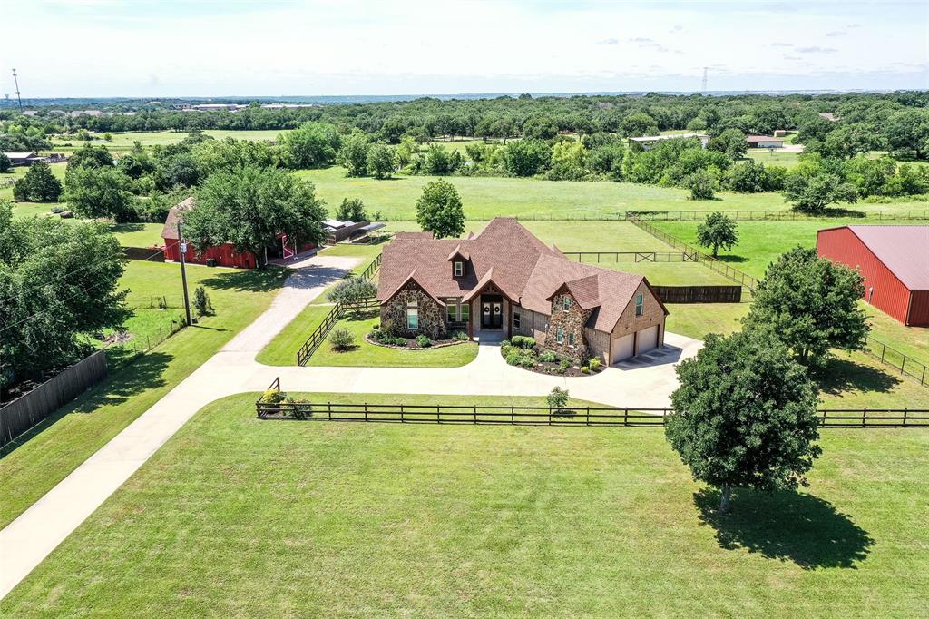 Private 3-Acre Estate in Argyle – Custom Home, Barn, and Guest Quarters!
Nestled on nearly 3 acres and set back from the road for ultimate privacy, this phenomenal north-facing, two-story custom home combines timeless craftsmanship with modern luxury. Surrounded by mature trees and beautifully maintained grounds, it offers serene living and breathtaking sunset views from the expansive back patio. Built with durable 2x6 construction, every detail of this residence reflects quality, comfort, and sophistication.
Inside, the home features 4 spacious bedrooms and 4 full baths, providing generous accommodations for family and guests. The thoughtfully designed layout blends classic architectural elements with contemporary touches throughout. The gourmet kitchen is a chef’s dream—complete with stainless steel appliances, custom cabinetry, and expansive countertops ideal for meal prep and entertaining. The open living and dining areas create a welcoming flow, while flexible spaces easily adapt for a home theater, office, or playroom.
The luxurious primary suite serves as a private retreat with a spa-inspired ensuite bath, dual walk-in closets, and sweeping views of the peaceful landscape. Every room has been designed for comfort, function, and connection to the property’s natural surroundings.
Outside, enjoy multiple patios perfect for relaxing or hosting under the trees. The grounds are meticulously landscaped, offering ample room for recreation, gardening, or simply enjoying nature. The impressive gambrel-style barn includes garage space for up to four vehicles, a private gym area, and a fully equipped accessory dwelling unit (ADU) ideal for guests, extended family, or a home office. A sustainable chicken coop and rainwater harvesting system add to the property’s self-sufficient appeal.
This extraordinary estate delivers an unmatched blend of privacy, luxury, and versatility—an exceptional opportunity to own a one-of-a-kind property in sought-after Argyle.
