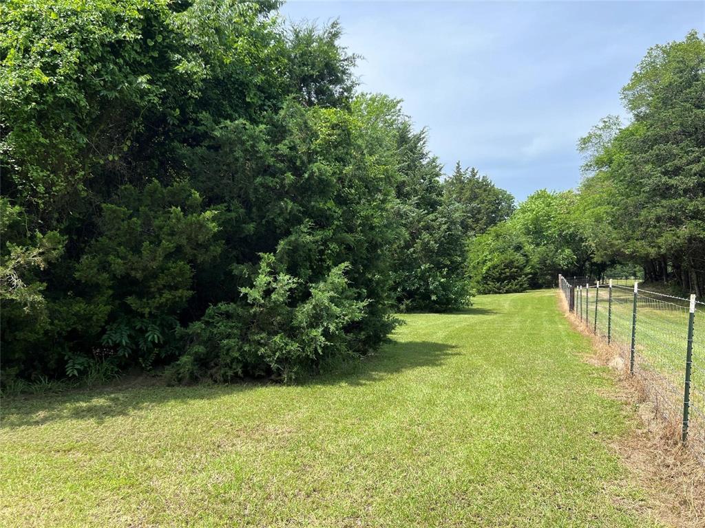Beautiful 2-Acre Homesite Near Lake Tawakoni & State Park with Utilities in Place!

Discover the perfect setting for your dream home, weekend getaway, or mobile home on this gorgeous 2-acre property in the desirable Wills Point ISD. Ideally located near Lake Tawakoni and the State Park, this tract offers a wonderful combination of open space and mature trees, creating both beauty and privacy.

A dense tree line along the road provides a secluded entrance, while scattered mature trees throughout the property add character and shade. Utilities are already in place with water and electric meters installed through Combined Consumers Water Supply and Trinity Valley Electric, making your building plans even easier. Spectrum fiber high-speed internet is also available, offering the convenience of reliable connectivity for work-from-home living.

The property is fenced on the north, south, and east boundaries with seller-owned barbed wire fencing reinforced with goat fencing, making it ideal for hobby farming, animals, or securing your investment. The west boundary fence will be owned by the buyer.

Whether you're ready to build now or looking for a peaceful investment near some of East Texas' best outdoor recreation, this rare property offers privacy, convenience, and endless possibilities just minutes from Lake Tawakoni.