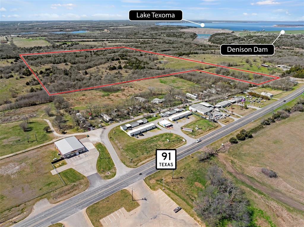 50 to 100 Acres Available for Development– Price Shown is for 50 ACRES at $35,000 an ACRE.  1 Minute to Lake Texoma and Denison High School. Discover the perfect blend of natural beauty and growth potential with this stunning 50–100-acre tract, nestled near HWY 75 and FM 91. This property offers the ideal setting for a private ranch, residential community or investment opportunity in one of the regions' fastest growing areas.  Enjoy rolling hills, mature trees, peaceful ponds and sightings of white-tailed deer, right outside your window.  The land's varied terrain makes it a dream for nature enthusiasts, whether you love fishing, boating, hiking or horseback riding, adventure is always close by.  Shawnee Creek meanders along the west boundary, complimented by small streams, a pecan orchard and direct access to US Corp property on the north and west sides.  This property sits just minutes from the new $6 Billion Preston Harbor Planned Community and Margaritaville Resort on Lake Texoma, making it a rare opportunity to invest in rapidly developing corridor.  Imagine being able to launch your boat and be on the Lake in 10 minutes!  With its prime location, scenic beauty, and endless development possibilities, this land is a rare gem that combines tranquility with convenience.  Whether you envision a luxury estate, a private retreat or subdivided parcels, the potential here is unlimited. Schedule your tour today and experience this incredible piece of North Texas land before it's gone!