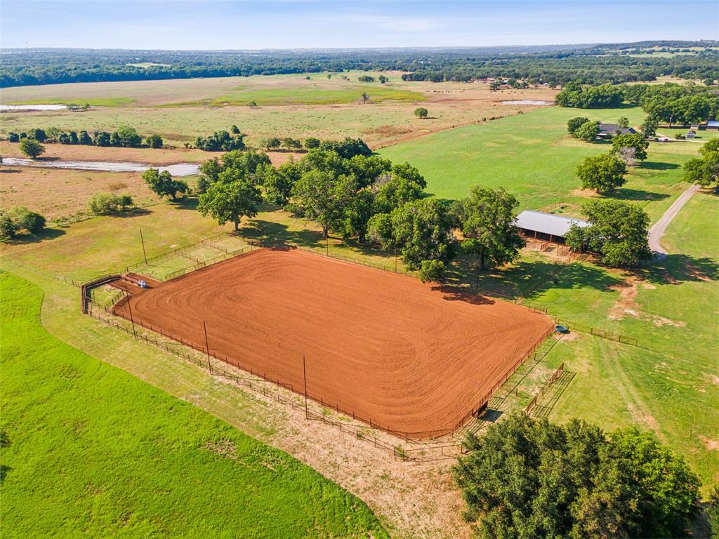 Seclusion, Privacy, Riverfront! This 48 ac plus estate embodies charm that is hard to find these days! The horsemen, cattlemen, or recreational seeker can check their boxes with this property.  A 3 2 brick main home with a spacious back porch patio and outdoor kitchen serves as a modest farm house, and a secondary 1000 ft GUEST HOUSE offers the added asset for income, guests or a foreman.  2 WATER WELLS and 1 WATER METER supply water throughout the property to all improvements.  A 2000 sq ft plus shop with double aprons can serve anyone’s need for projects, storage and additional parking.  A horse lovers 5 stall BARN w enclosed tack and RV hookups tie in perfect with a 170 by 270 ROPING ARENA w prefiert chute.  Thoughtful cross fencing generates 5 coastal Bermuda pastures, all w water, along with one set of cattle pens, to rotate livestock accordingly. 900 ft of the BRAZOS RIVER sets the scene for recreation and romance under the canopy of Pecan and Oaks trees.  This is a must see!