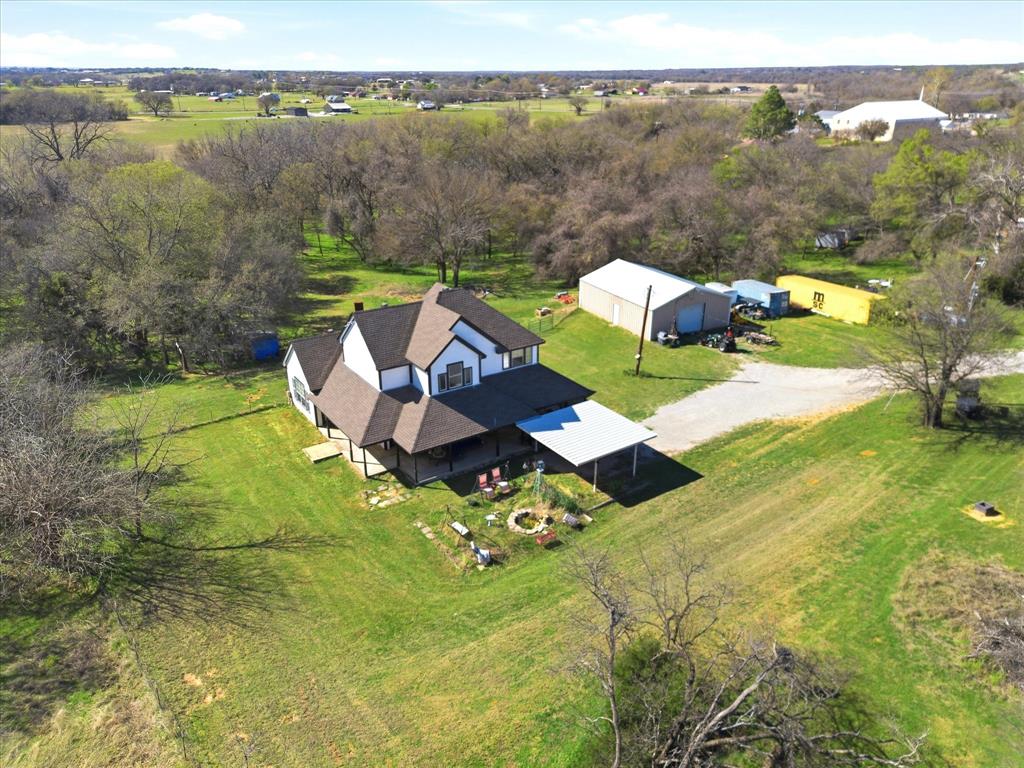 Motivated Sellers 
Privacy. Acreage. Nature. 
Welcome to 130 Parsonage — your chance to own over 5 acres of peaceful Texas living with room to roam, entertain, and unwind.

FULLY fenced in property-

zero turn mower + tractor can be included in negotiations 
Spacious home + beautiful land can be included in negotiations 
The perfect blend of country living & convenience

Outdoors, the property truly shines. The fully fenced 5.514 acres offer a scenic creek running along the back of the land. Wildlife, including deer, are frequently seen, creating a peaceful environment. Enjoy quiet mornings or relaxing evenings on the covered front and back porches, both upgraded with ceiling fans.

A standout feature is the 30x40 shop, equipped with water, electricity, and a 240-volt outlet—ideal for a workshop, storage, or hobby use. The property also includes an RV electric hookup, providing added flexibility.

Additional features include a private water well, expansive outdoor space, and minimal traffic due to its end-of-street location.
Opportunity to own a private property that combines acreage, functionality, and thoughtful updates—all in a secluded setting.
Truly a MUST see!

Buyer and buyer’s agent to verify all information, including but not limited to square footage, acreage, schools, utilities, zoning, and restrictions.
“Sale includes two parcels totaling 5.514 acres (Parcel IDs:R000109108 & R000051847
Legal Description :R000109108- Acres: 4.514, Abst: 1222, Survey: SHORT ROBT T, TR:, BLK:, SURV: ROBT. T. SHORT
Legal Description: R000051847-Acres: 1.000, Abst: 1222, Survey: SHORT ROBT T, TR:, BLK:, SURV: ROBT. T. SHORT