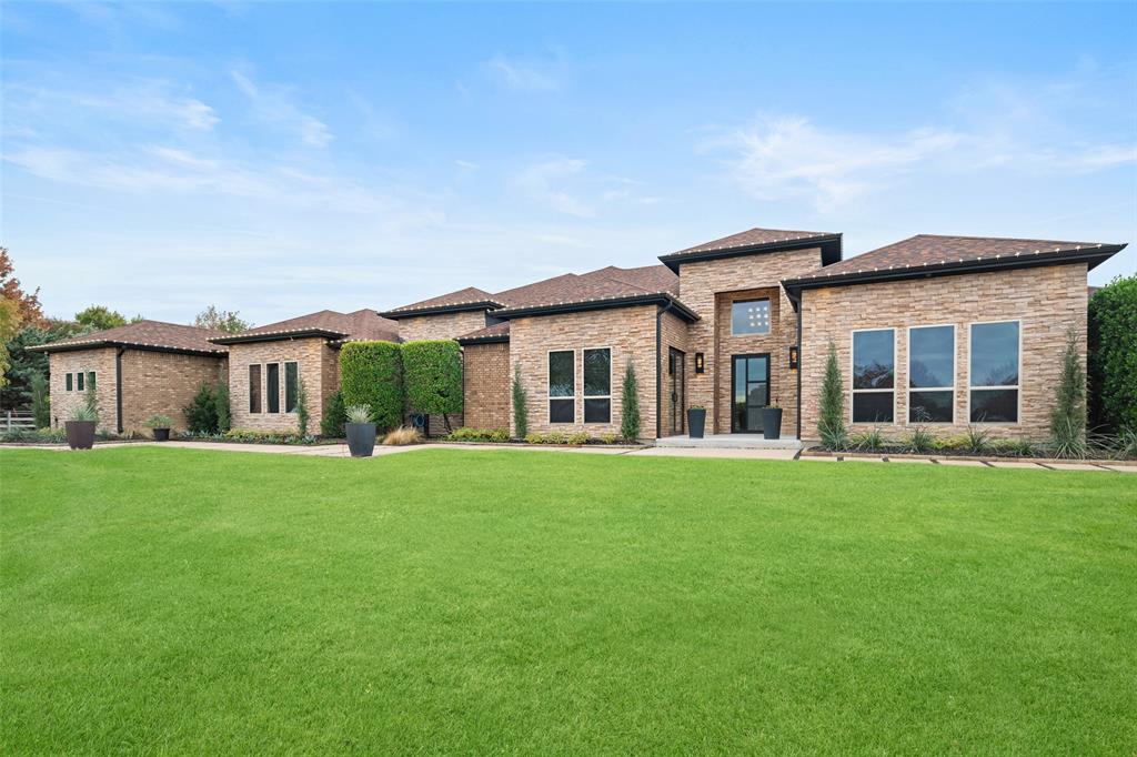 CUSTOM single-story home situated on 2 Acres; 4 Ensuite Bedrooms; the kitchen holds many of the features of a gourmet kitchen: Custom 9.5ft bamboo style cabinetry; THIRTY TWO oversized soft-close drawers, SUBZERO Full Size Columns Refrigerator & Freezer; dbl ovens; full wall-in pantry; Smart Home - CONTROL4 technology - lighting, audio-visual systems, window shades & thermostats; WINE BAR w floating wine racks & custom cabinets, sink & wine cooler; combination media, game room & WET BAR with dishwasher, mini-refrig, ice maker, custom feature walls; Separate MAN CAVE - 2,400 sq.ft. climate-controlled garage stores 10-cars+, RV, etc., custom cabinets & workbench; outdoor living w HEATED POOL, multiple seating, dining & tanning areas; Located in the highly accredited LOVEJOY ISD; CONVENIENT to shopping, dining & entertainment; ONLY 38miles to DFW Airport; FURNITURE negotiable. TransactionDesk for List of Special Features. Home:5490sqft + 2400sqft separate garage =$278.71price per sq ft.