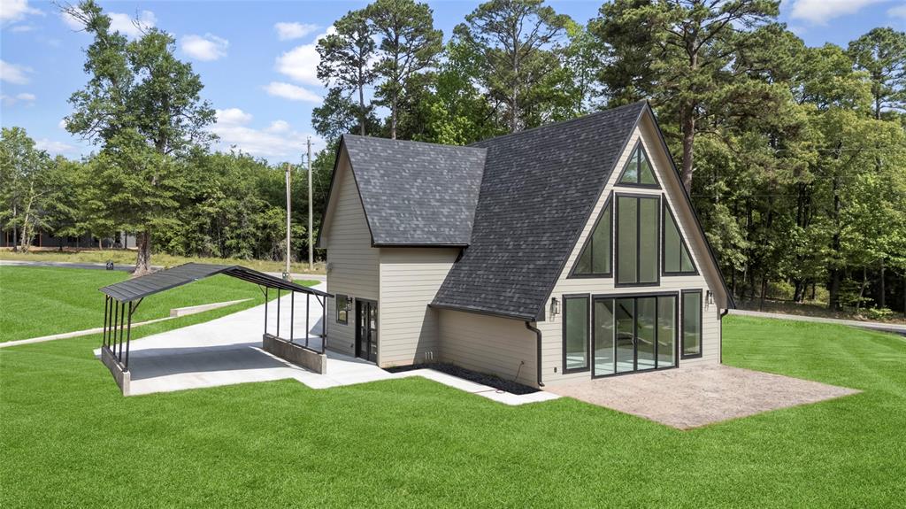 LAKEVIEW HOME!!!! Welcome to 268 County Road 2297 in Mineola…a one-of-a-kind, brand new A-frame lakeview home that captures the essence of the lakehouse dream. From the moment you arrive, the architecture sets it apart, and once inside, it only gets better. Soaring 25-foot ceilings and a wall of floor-to-ceiling windows flood the home with natural light and showcase peaceful lake views, creating an open, airy feel. The unique A-frame design paired with custom finishes throughout makes this home unlike anything else on the market. The thoughtfully designed layout offers 3 bedrooms and 2 bathrooms with a functional, flexible floorplan. The primary suite is a true retreat with a huge walk-in shower and oversized walk-in closet. A secondary bedroom is located downstairs, ideal for guests or an office. Upstairs features a spacious 28x12 bedroom with its own bathroom and closet, perfect as a multi-use bedroom, game room, or additional living space. Stamped concrete floors run throughout, adding durability and character. Step outside to a large back patio, perfect for grilling, entertaining, and enjoying lake views. The property also offers a 2-car carport plus additional parking for guests, boats, or lake toys. Located just minutes from the boat ramp at Lake Holbrook, you’ll enjoy easy access to fishing, boating, and skiing. Outside city limits and zoned to highly sought-after Alba-Golden ISD. Just minutes from downtown Mineola for local dining, shopping, and small-town charm. This is more than a home…this is the lake lifestyle you’ve been waiting for. A true gem and rare opportunity to own something completely unique.