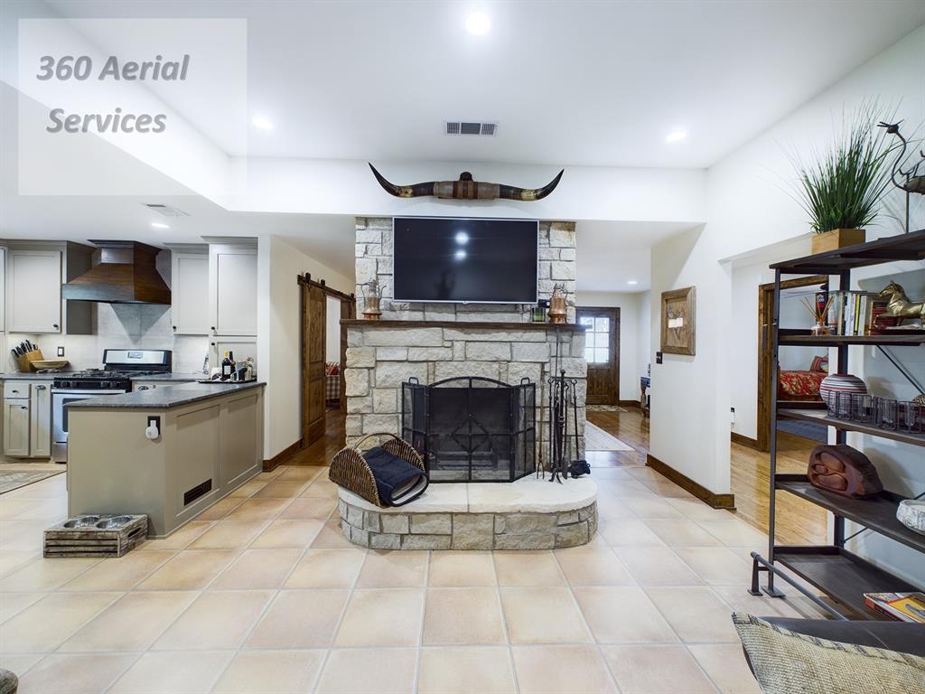 Home was completely remodeled in 2019 & has hardwood oak floors & laminate tile. Beautiful knotty alder wood doors & trim  and recessed lighting make it seem like there's a ton of natural light. There are 3 bedrooms, 2 baths with walk-in showers, an office, a sitting or reading room & then of course dining, kitchen & living room with a wood burning stone fireplace. Home is well shaded from the summer sun by large mature Elm, Pecan and Oak trees. Land consists of approx 110 acres in Coastal Bermuda grass (generally produce 2 cuttings per year at 2-3 bales per acre), approx 88 acres in cultivation, 165 acres in native pasture & 290 acres that are heavily wooded which are scattered around the property.  Sabana River meanders through the south half of the property which allows for wildlife habitat galore. 30x50 Metal Shop beside the house with concrete floor & 20 ft overhang, 30x70 Metal & Wood Pole National Barn with gravel floor & Older equipment shed. Some furnishings negotiable.