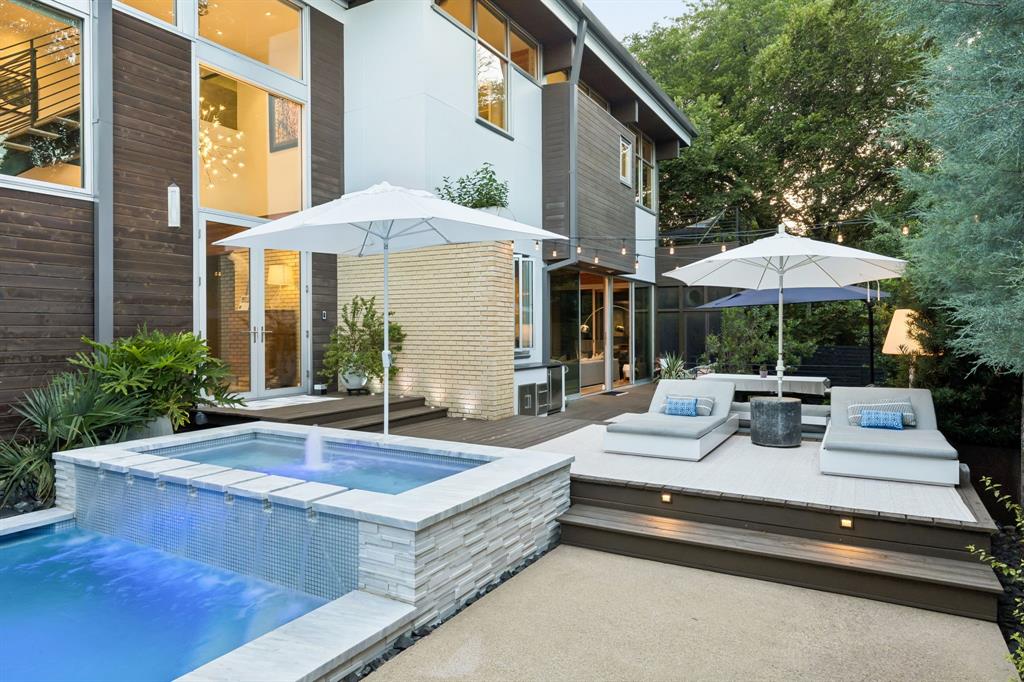 Located within the intimate gated community of Kessler Woods, this architecturally striking modern home blends clean design, natural light, and extensive upgrades in one of Dallas’ most coveted neighborhoods.

Expansive windows and custom Fleetwood sliders create seamless indoor-outdoor living. The open kitchen, dining, and living spaces flow to a screened porch, expansive deck, and a 2024 saltwater pool with custom glass tile and heat-chill system—offering both privacy and effortless entertaining.

The updated kitchen features white quartz countertops, instant hot water, premium cooking appliances, and a Sub-Zero wine refrigerator. The main level includes a guest bedroom and powder bath for flexibility and convenience.

Upstairs offers a dedicated study, two bedrooms connected by a Jack-and-Jill bath, and a spacious primary suite with treetop views, fireplace, and private veranda. The renovated primary bath includes a soaking tub, custom glass shower, heated towel rack, dual vanities, and a California Closets walk-in with marble counters.

Outdoor living is elevated with a leathered granite outdoor kitchen featuring a Coyote grill, Uline refrigerator, gas connection for a future fire feature, Sonance landscape speakers, mosquito misting system, and mature evergreen landscaping for year-round privacy.

Additional improvements include refinished white oak floors, full interior and exterior repainting, commercial-grade TPO roof, custom metal gutters, upgraded HVAC systems including a dedicated heat pump for the primary suite, and reinstalled windows with proper flashing.

Kessler Woods is known for its architect-designed homes, pocket parks, and gated privacy just minutes from Stevens Park Golf Course, Bishop Arts, Downtown, and Uptown. Modern architecture and thoughtful updates create a private retreat designed for both entertaining and everyday ease.