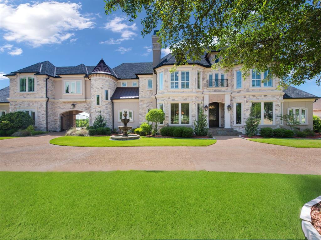 Timeless elegance awaits in the smallest Texas county, with one of the richest lifestyles. Minutes from Dallas, Rockwall's gorgeous lake views and rolling hills invite you to relax. Enjoy sunset dining, lush parks, lake life, small-town charm and top-tier education. In gated community of Oaks of Buffalo Way, this manor features 7,000 sf of French-inspired, custom craftsmanship across 1.5 acres. Savor poolside days, dine al fresco, enjoy fireside evenings positioned for western sunsets. With 5 fireplaces, 4 bedrooms, and 6 baths in the main house, plus detached 5th bedroom-flex space with ensuite bath, this estate caters to every desire. Host gatherings in dining room, relax in living spaces, enjoy wine bars, game room, cinema. Owners' suite features pool views, tranquil ensuite bath, grand closets with (shhh) secret passage to study. 4-car garage hobby-storage space. Extensive updates, newly installed roof and whole-house generator for year-round comfort and peace of mind.