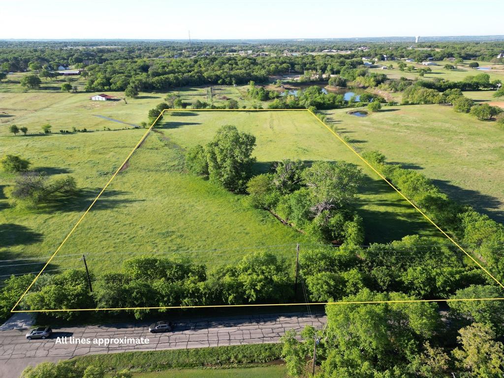 Discover a rare 7.36-acre luxury estate opportunity located in Bartonville, Texas with NO HOA! Located just one mile from Lantana Town Center and its shops, dining, and everyday conveniences. This ag-exempt, fully fenced tract offers the ideal setting for a private, gated estate with room for a grand main residence, guest house, pool, barn, or equestrian amenities. Bring your horses, livestock, or hobby-farm animals and enjoy the freedom and space this property provides. Bring your own builder and design the estate that reflects your vision.
Let your imagination run wild—whether you’re planning a statement-making residence, a purpose-built equestrian layout, or a multi-generational living arrangement with thoughtfully designed guest accommodations. Multiple prime building sites allow you to tailor the land to your lifestyle, from expansive outdoor living to functional accessory structures.
This property also presents a compelling buy-and-hold investment opportunity, with the agricultural exemption offering exceptionally low carrying costs while the area continues to grow in demand and value.
Enjoy the privacy and openness of true acreage living while staying close to the suburban conveniences that make this location so desirable. Situated within Denton ISD, the property offers a blend of seclusion, accessibility, and long-term appeal. Electric and Cross Timbers Water are available at the road; septic required.
Large parcels this close to Lantana amenities are exceptionally rare. Whether your vision leans toward luxury living, equestrian use, multi-generational flexibility, or a strategic land investment, this property provides the setting and versatility to bring it to life.